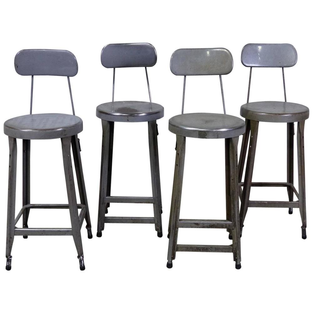 Set of Four Counter Height Industrial Stools | Scott Landon Antiques and Interiors.