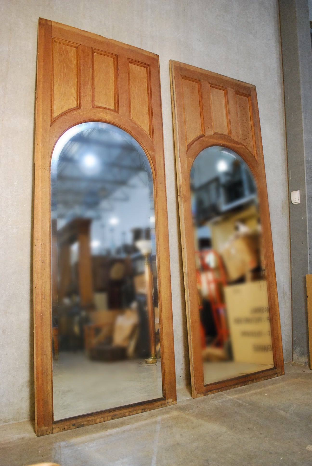 1900 Solid oak panels with arched beveled mirror | Scott Landon Antiques and Interiors.