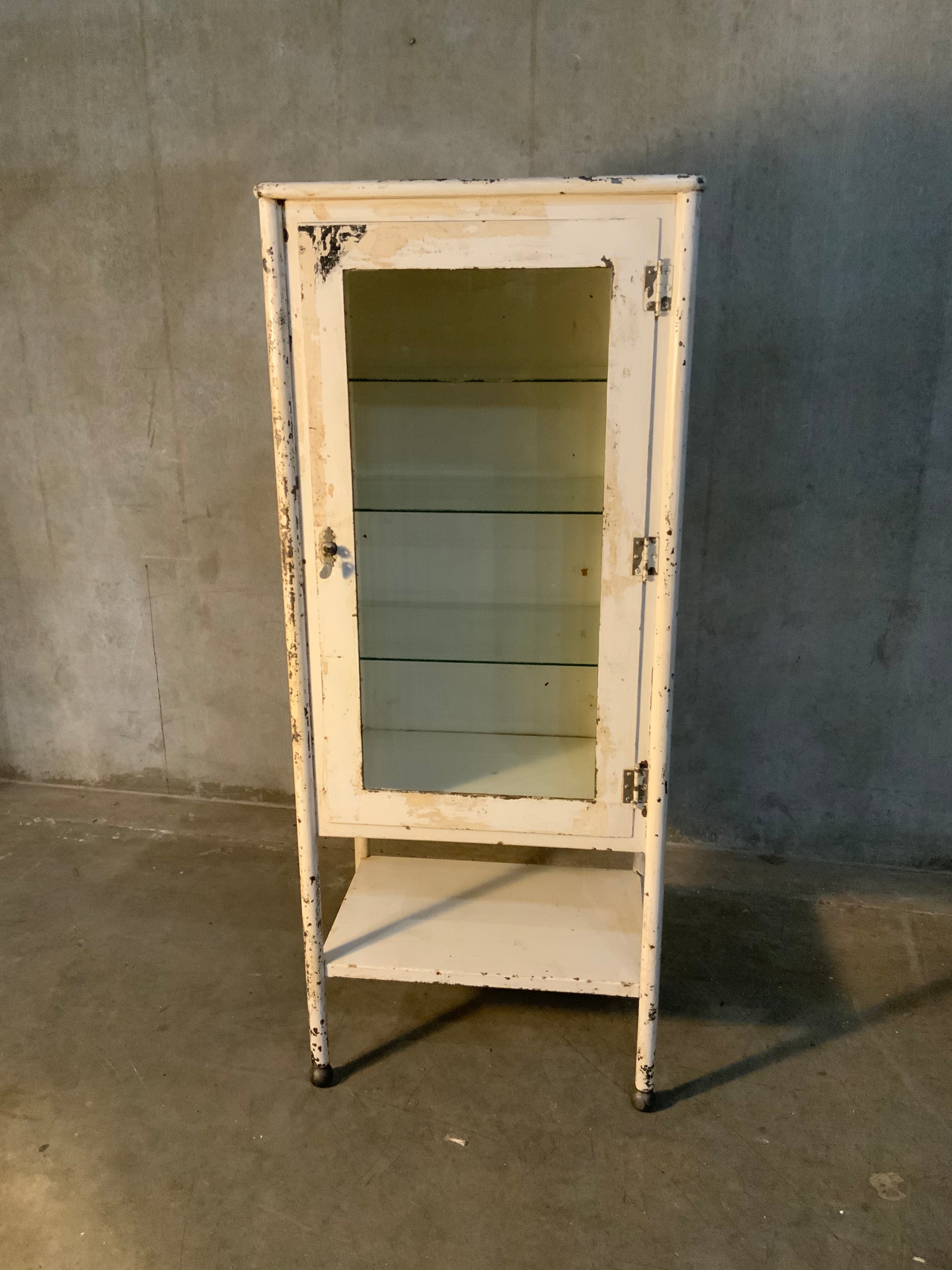 1920 glass door medical cabinet in old finish | Scott Landon Antiques and Interiors.