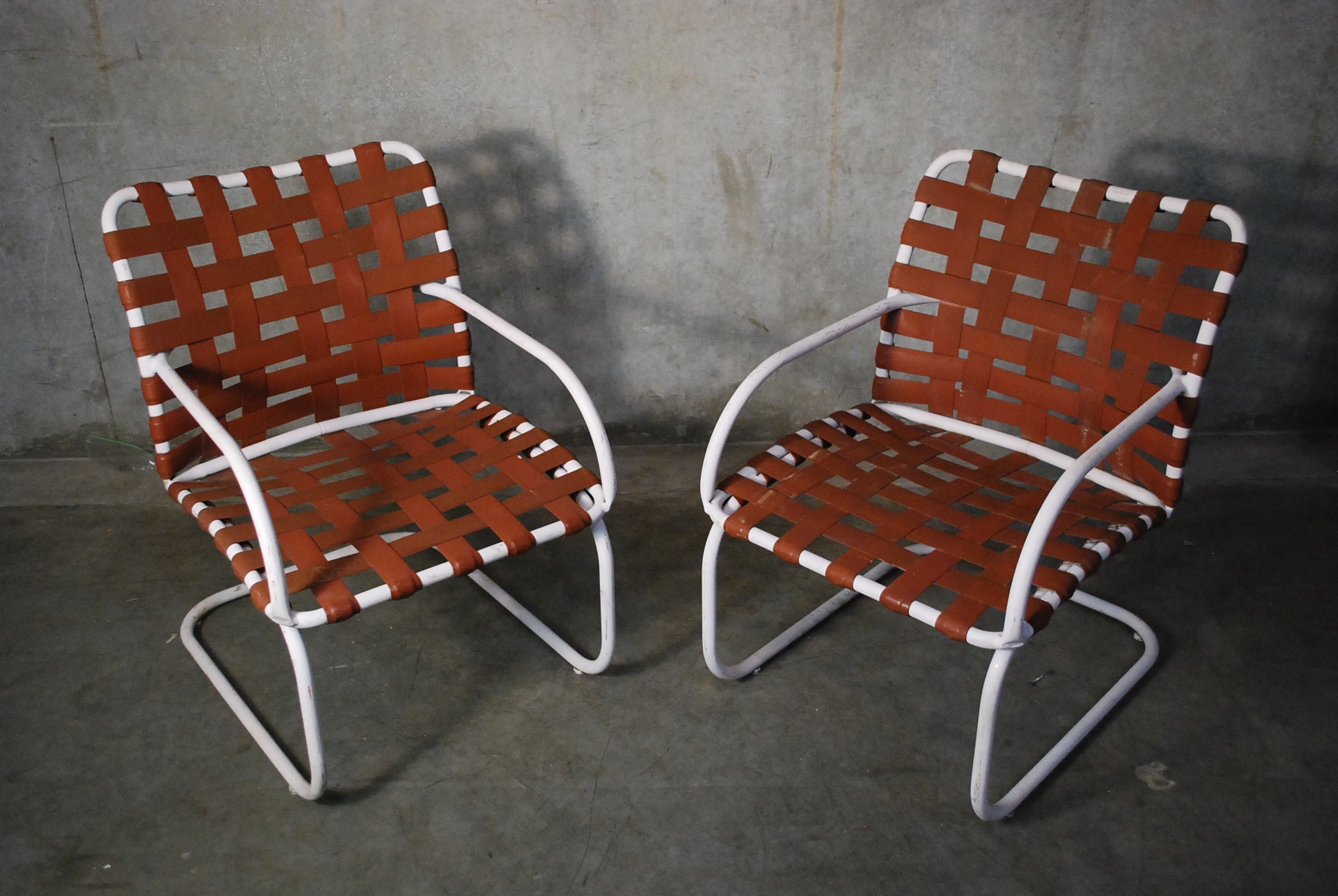 1950 Pair of Brown Jordan Cantilevered Outdoor chairs | Scott Landon Antiques and Interiors.