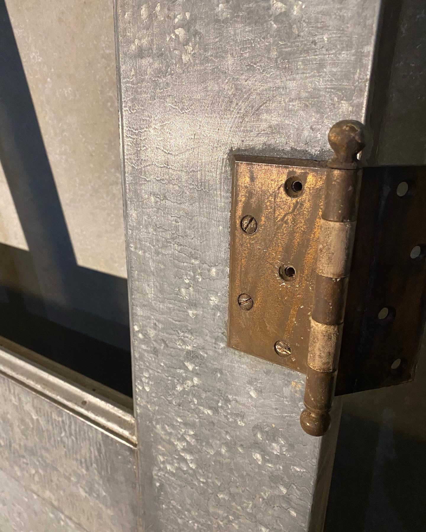 1920 zinc ‘galvanized industrial door with glass window | Scott Landon Antiques and Interiors.