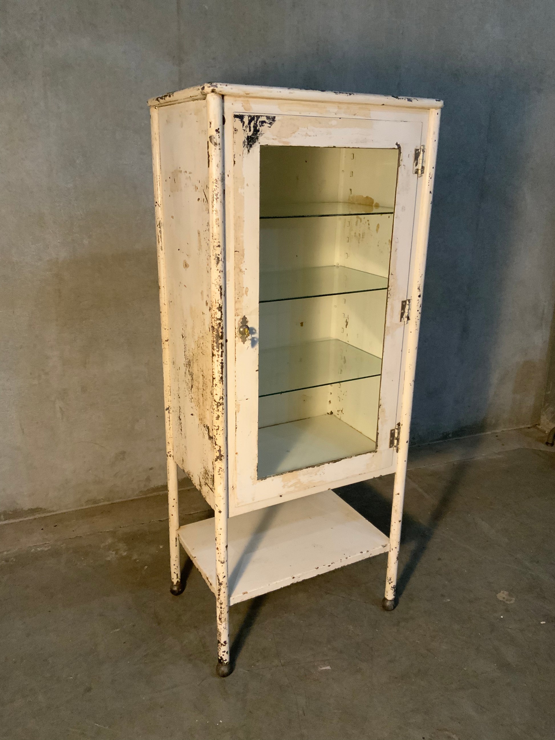 1920 glass door medical cabinet in old finish | Scott Landon Antiques and Interiors.
