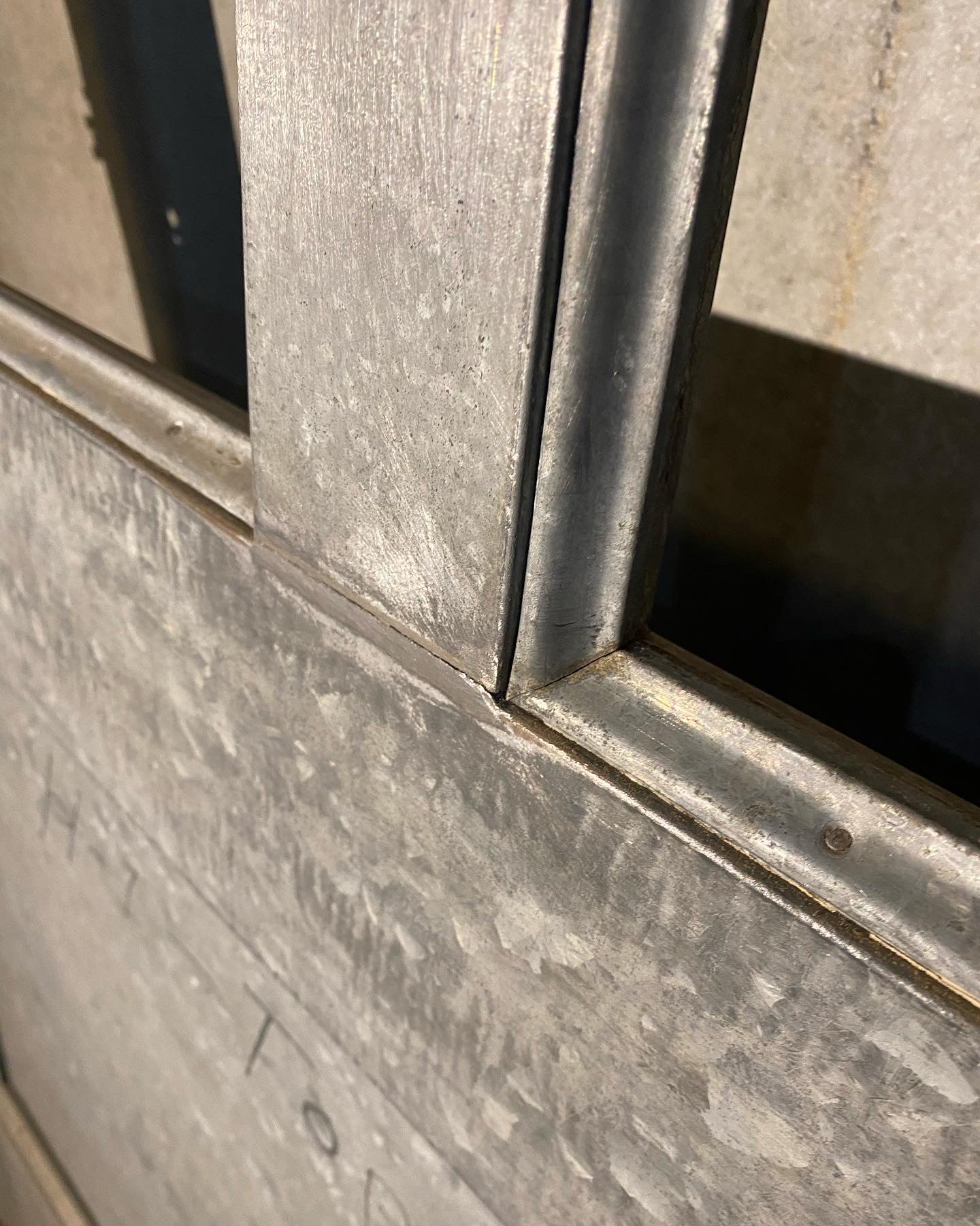 1920 zinc ‘galvanized industrial door with glass window | Scott Landon Antiques and Interiors.