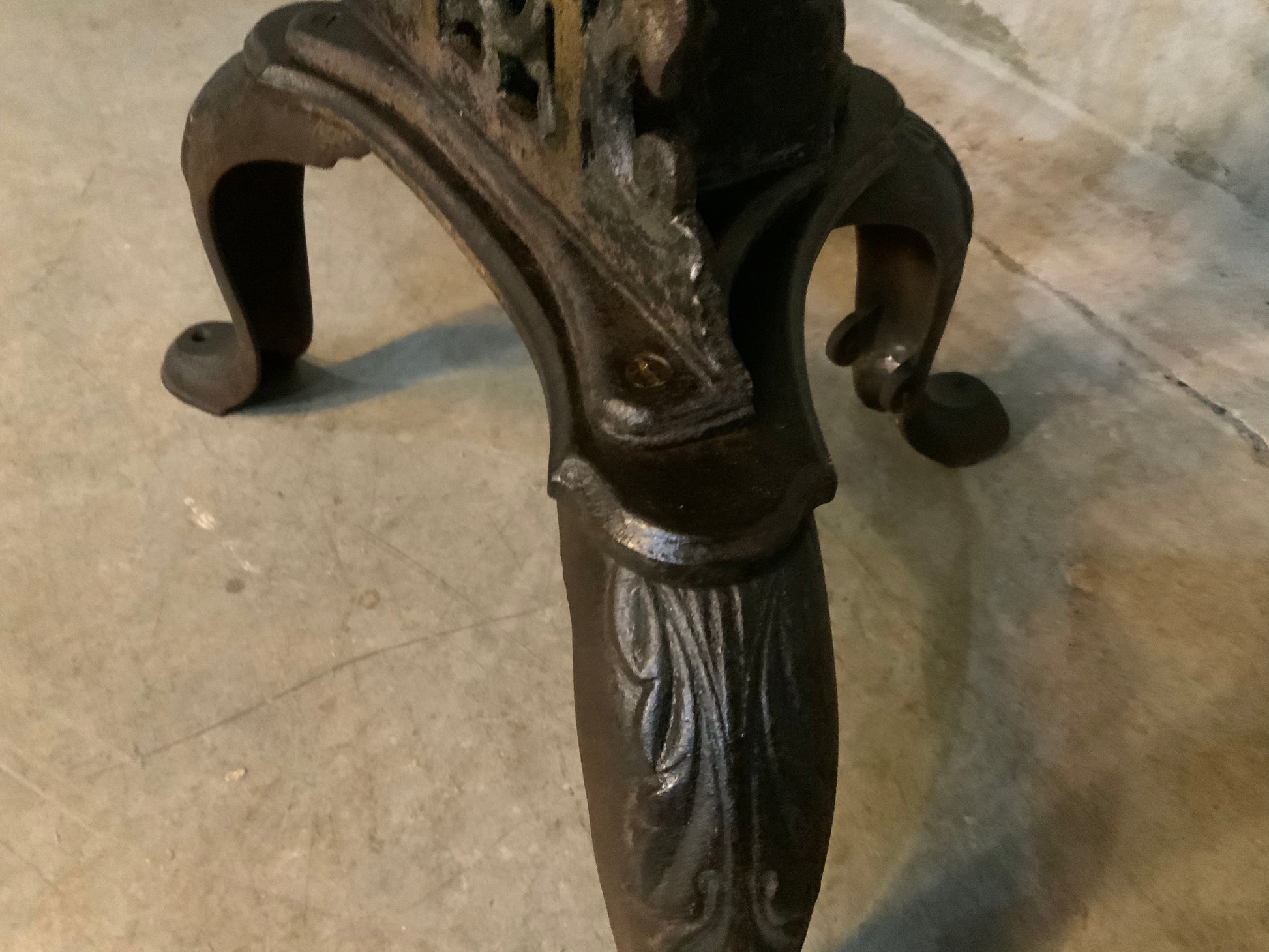 C 1900 cast iron detailed table base with marble top | Scott Landon Antiques and Interiors.