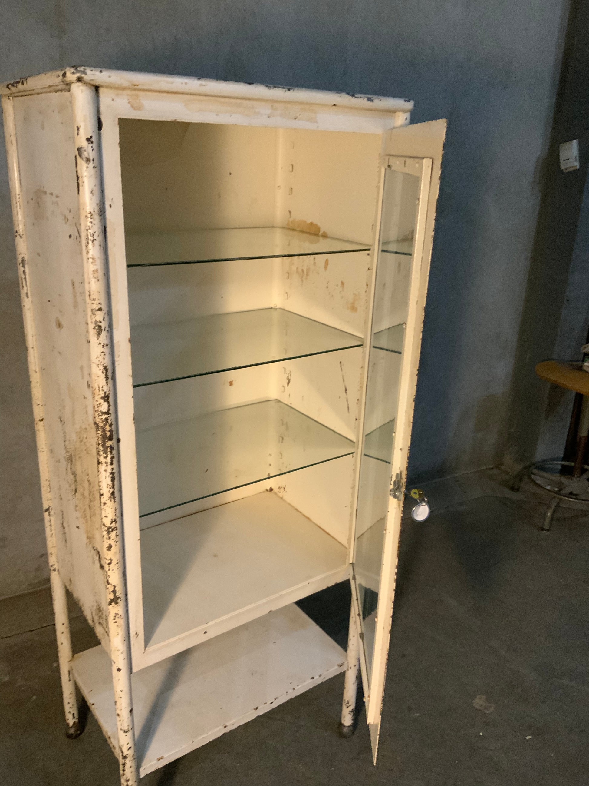 1920 glass door medical cabinet in old finish | Scott Landon Antiques and Interiors.