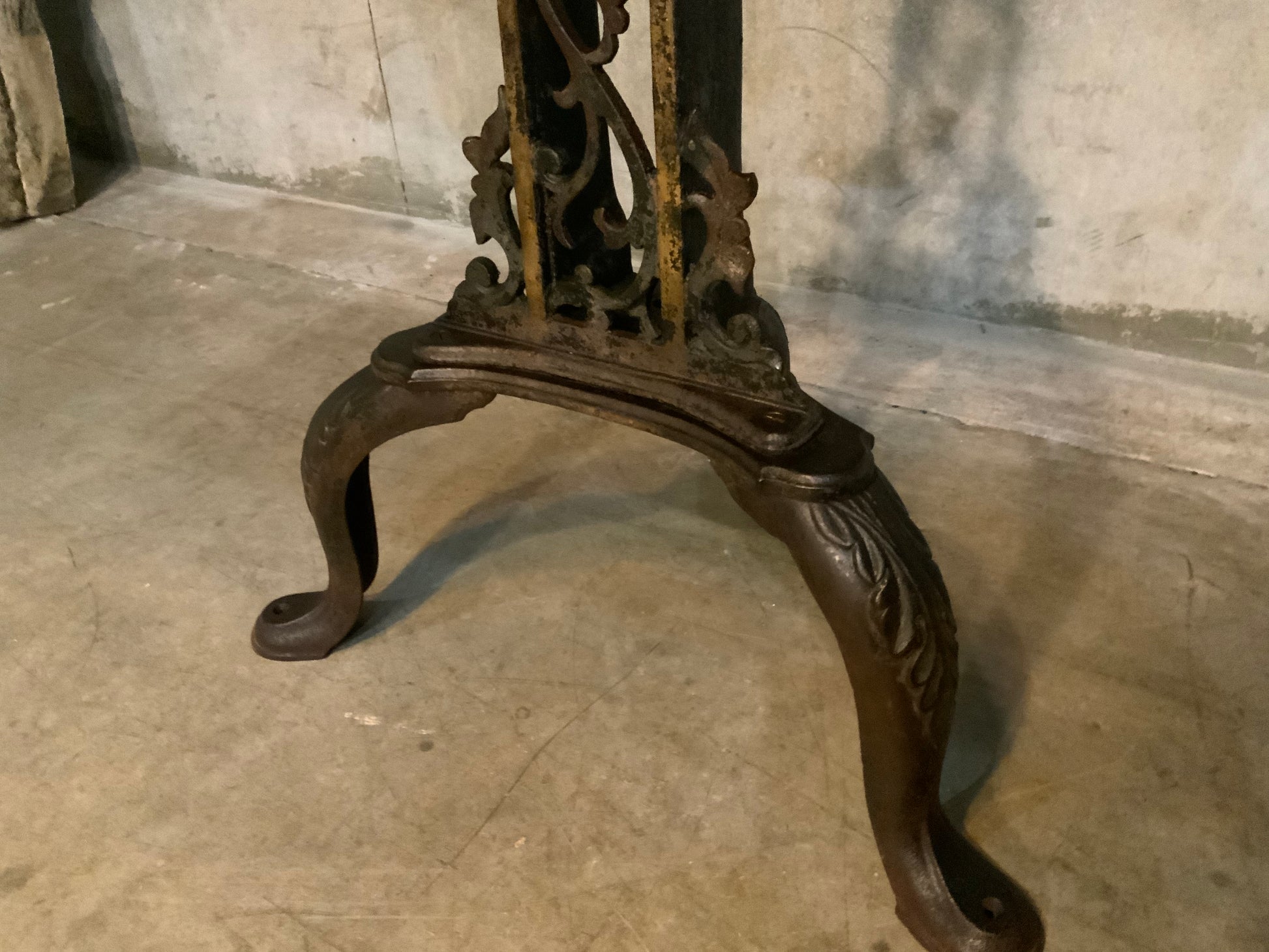 C 1900 cast iron detailed table base with marble top | Scott Landon Antiques and Interiors.