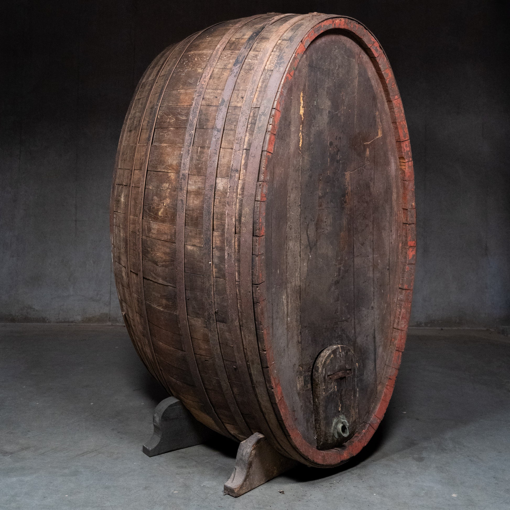 Monumental antique Italian wine cask circa 1900, five feet tall, with wood stave construction, iron bands and original aged surface. | Scott Landon Antiques and Interiors.
