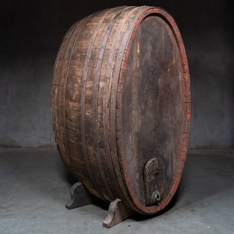 Monumental antique Italian wine cask circa 1900, five feet tall, with wood stave construction, iron bands and original aged surface. | Scott Landon Antiques and Interiors.