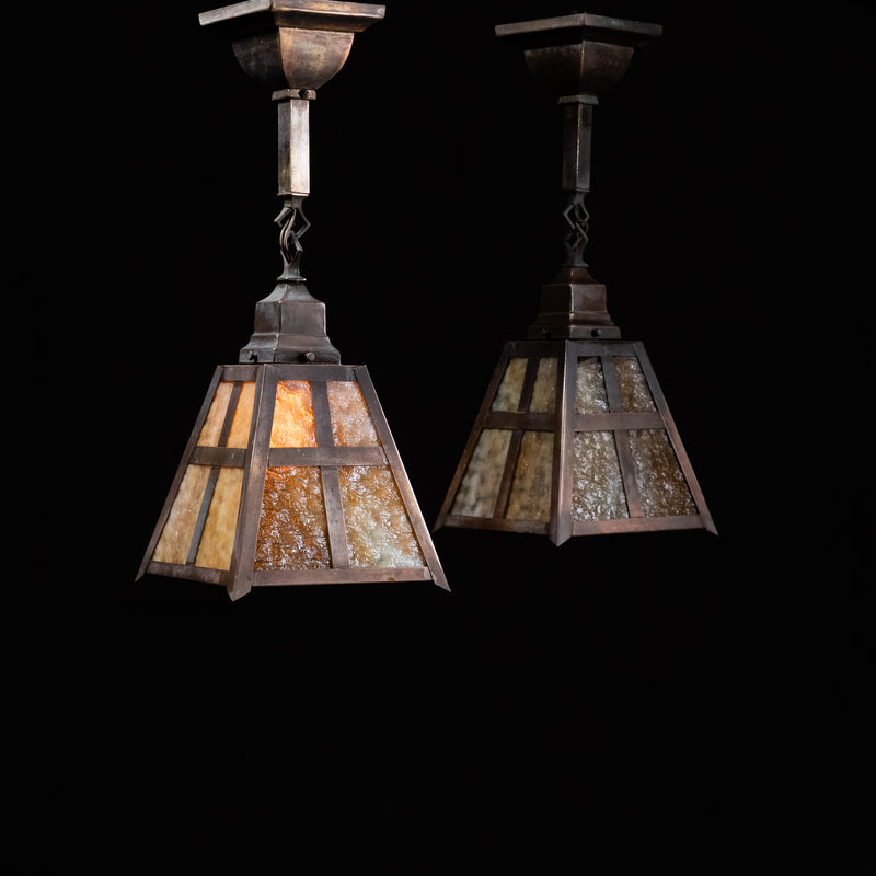 Pair of antique 1920s copper and brass Arts and Crafts ceiling lights with amber slag glass | Scott Landon Antiques and Interiors.