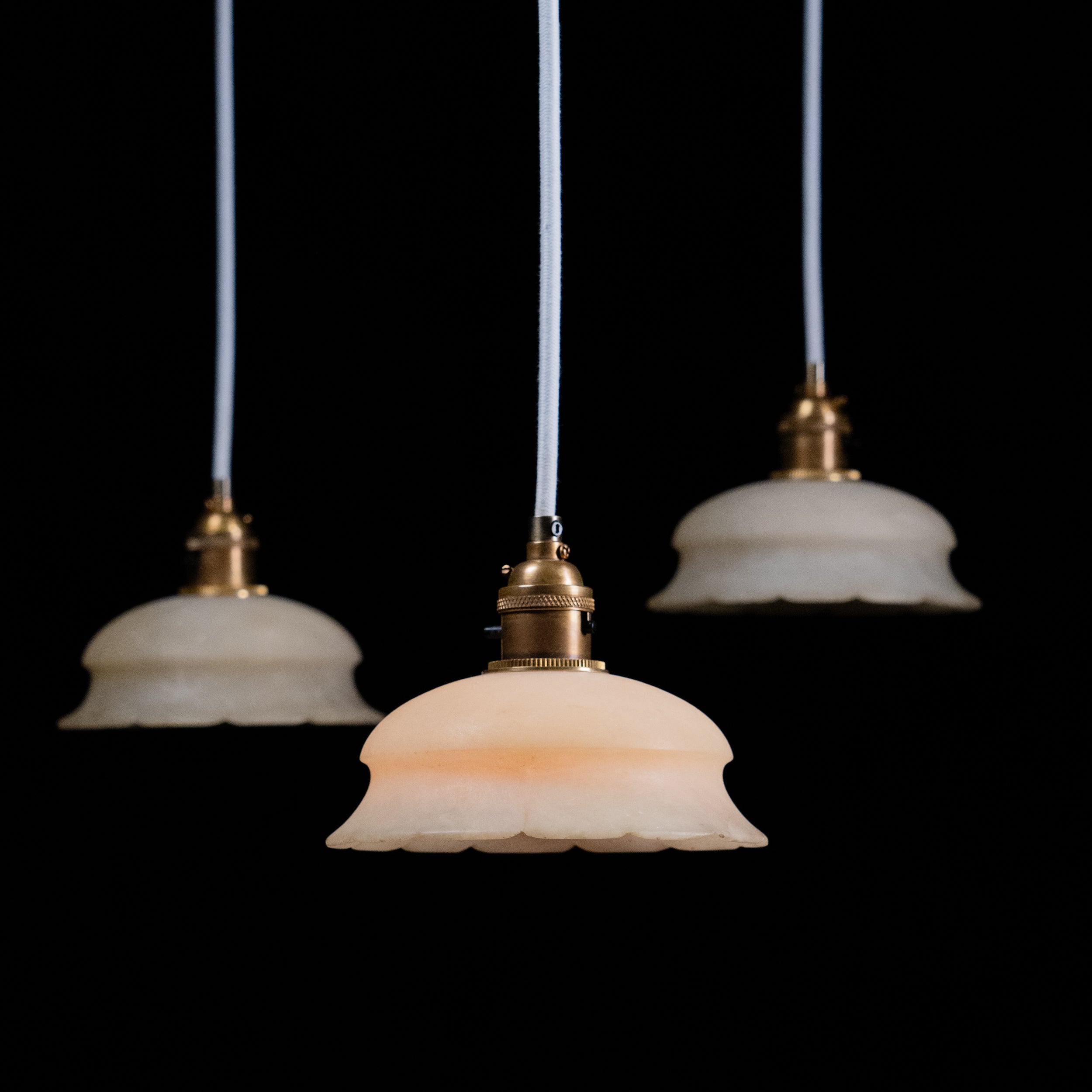Set of three antique alabaster pendant lights with brass fittings circa 1920 | Scott Landon Antiques and Interiors.