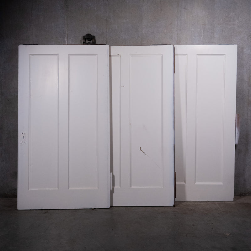 Large antique two-panel wood pocket doors with original hardware circa 1910 | Scott Landon Antiques and Interiors.