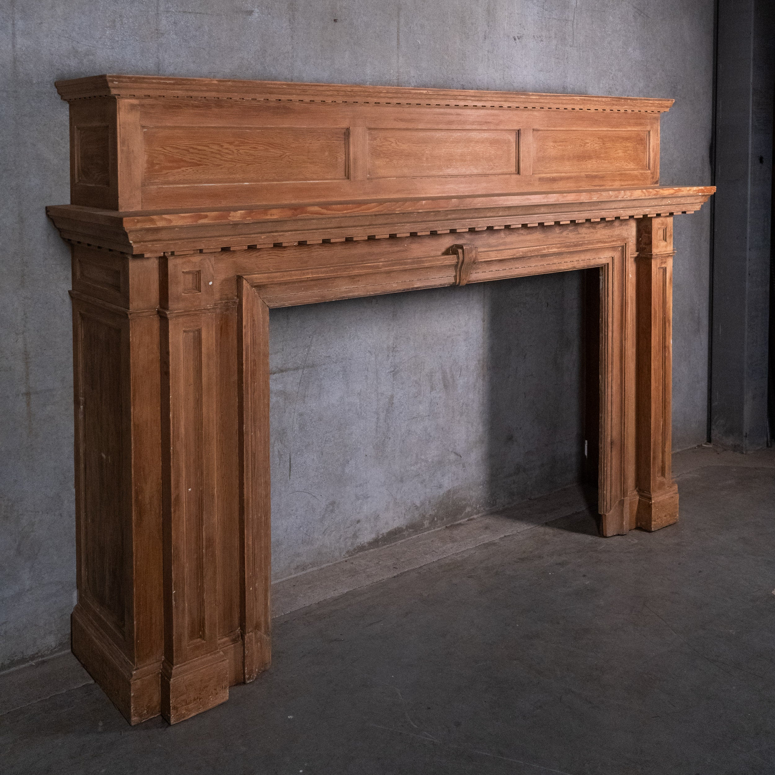 Large antique Douglas fir fireplace mantel with paneled overmantel circa 1910 | Scott Landon Antiques and Interiors.