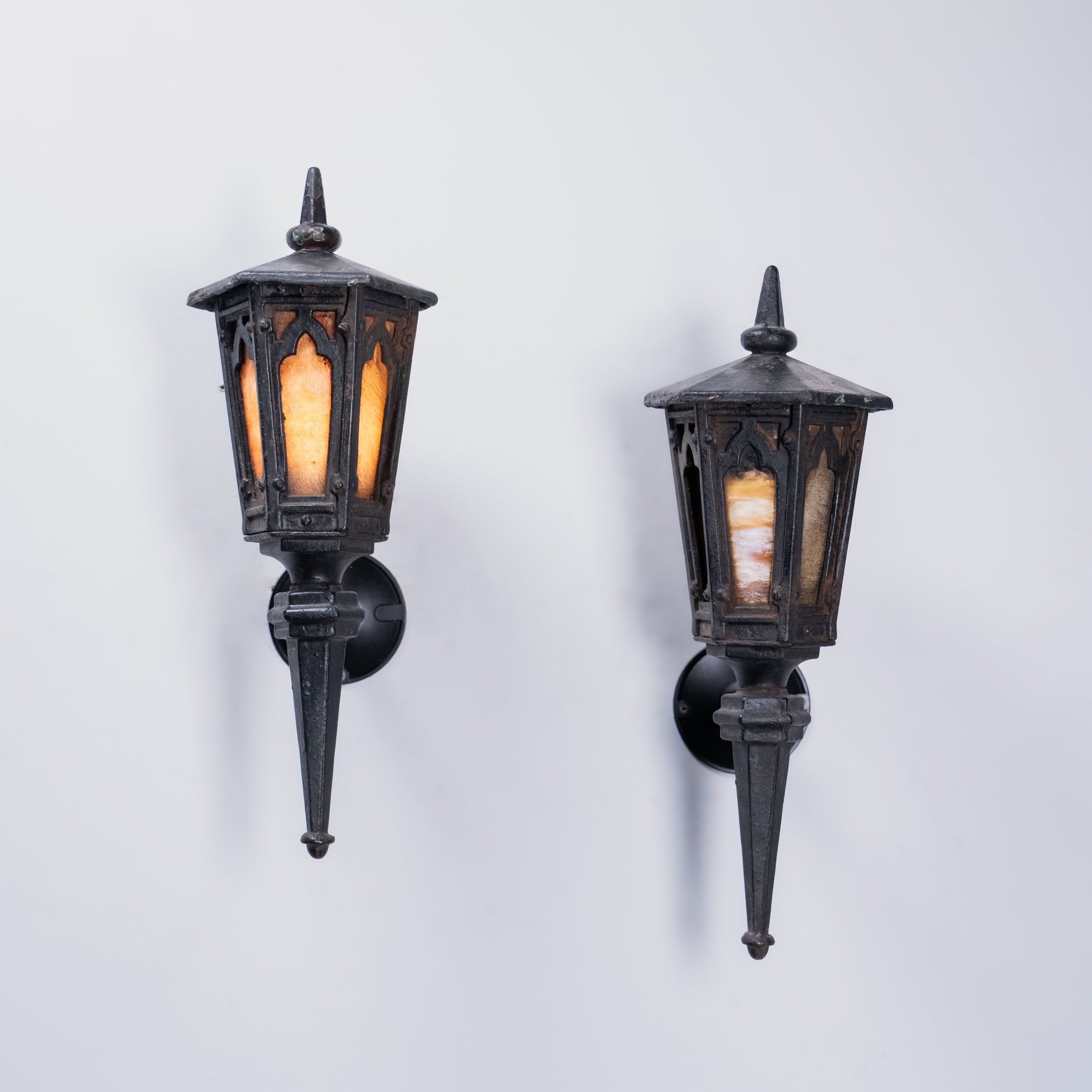 Pair of Gothic Revival Cast Iron Wall Lanterns with Amber Glass Panels – Tudor Style Exterior Sconces