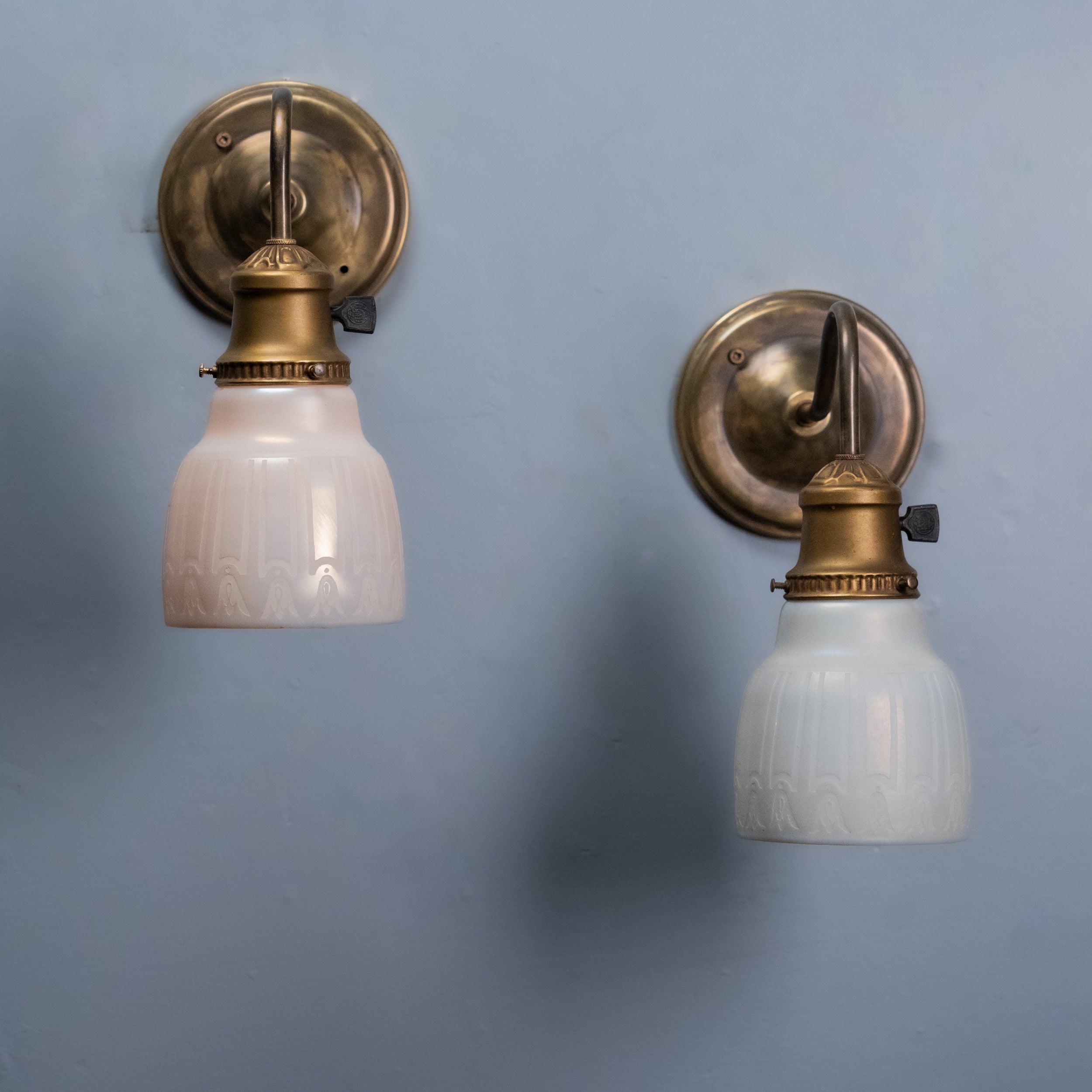 Antique milk glass  brass sconces | Scott Landon Antiques and Interiors.