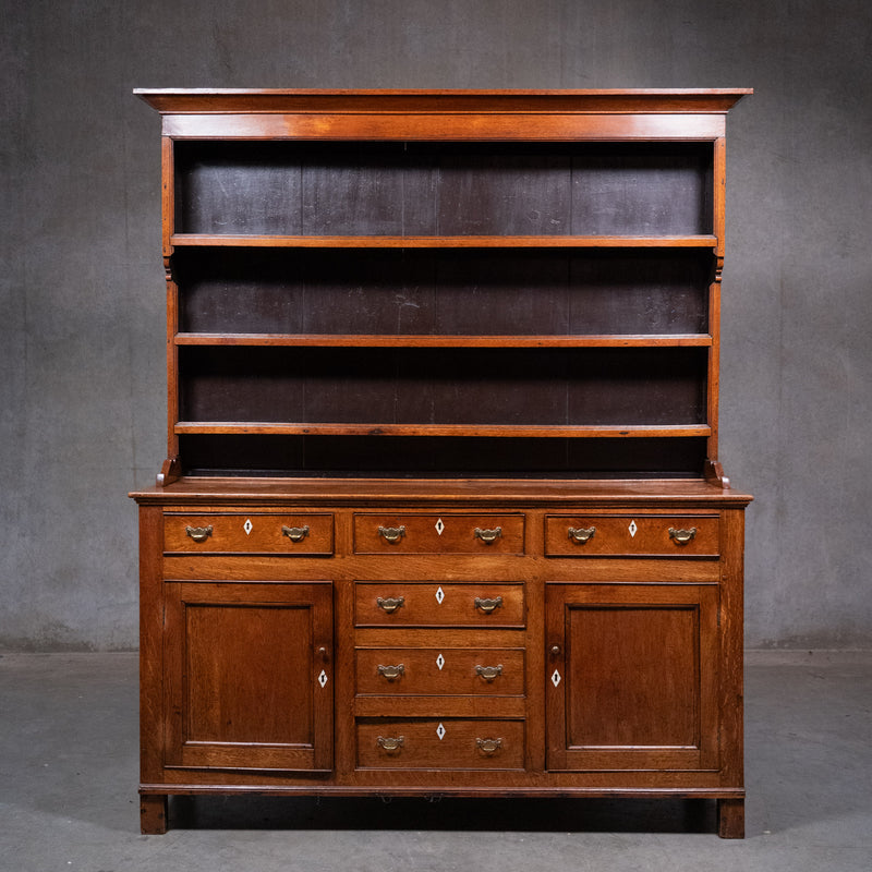 Antique Welsh oak dresser circa 1800 with open plate rack, drawers and panelled cupboard doors | Scott Landon Antiques and Interiors.