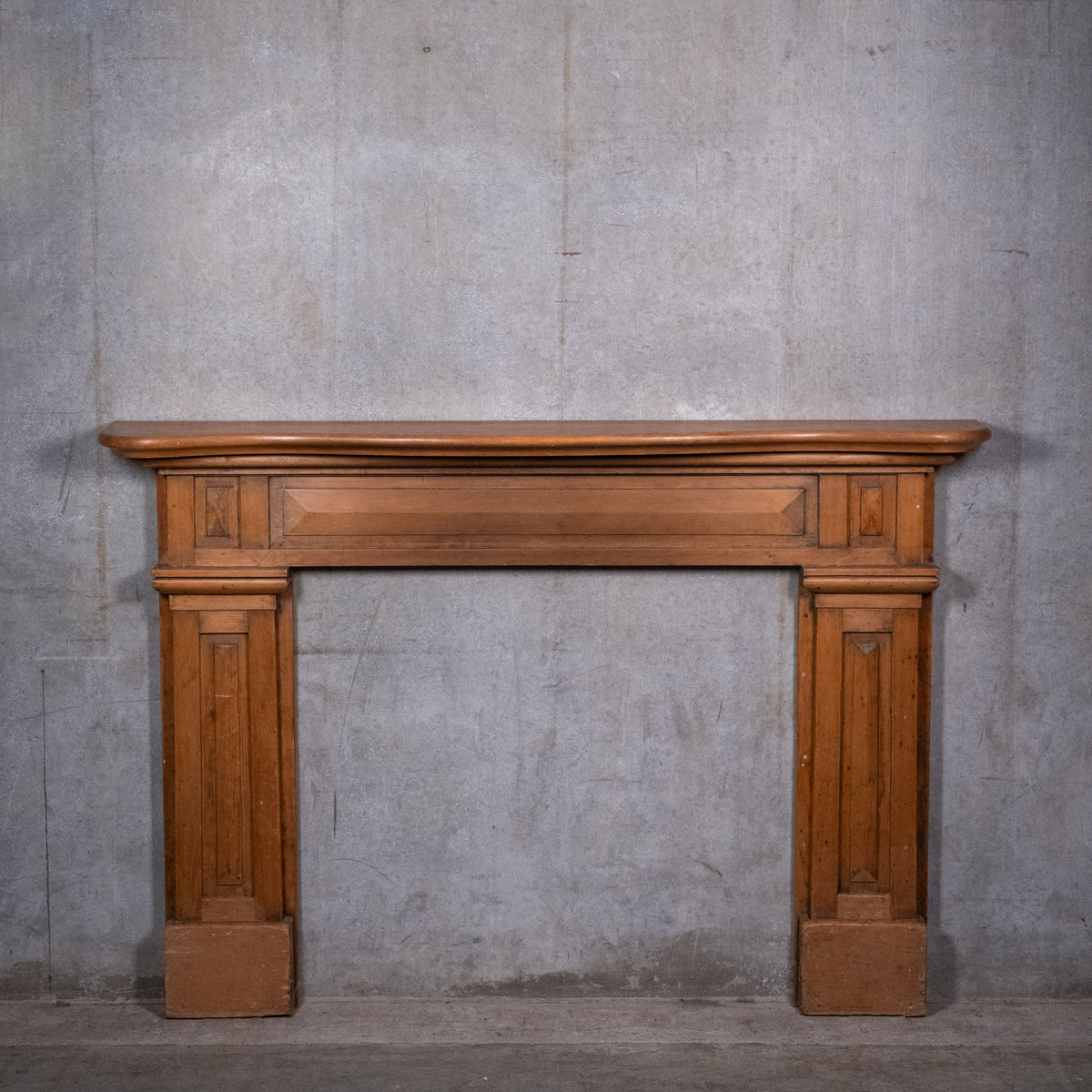19th century Quebec pine fireplace mantel circa 1880 with carved geometric details and moulded shelf | Scott Landon Antiques and Interiors.