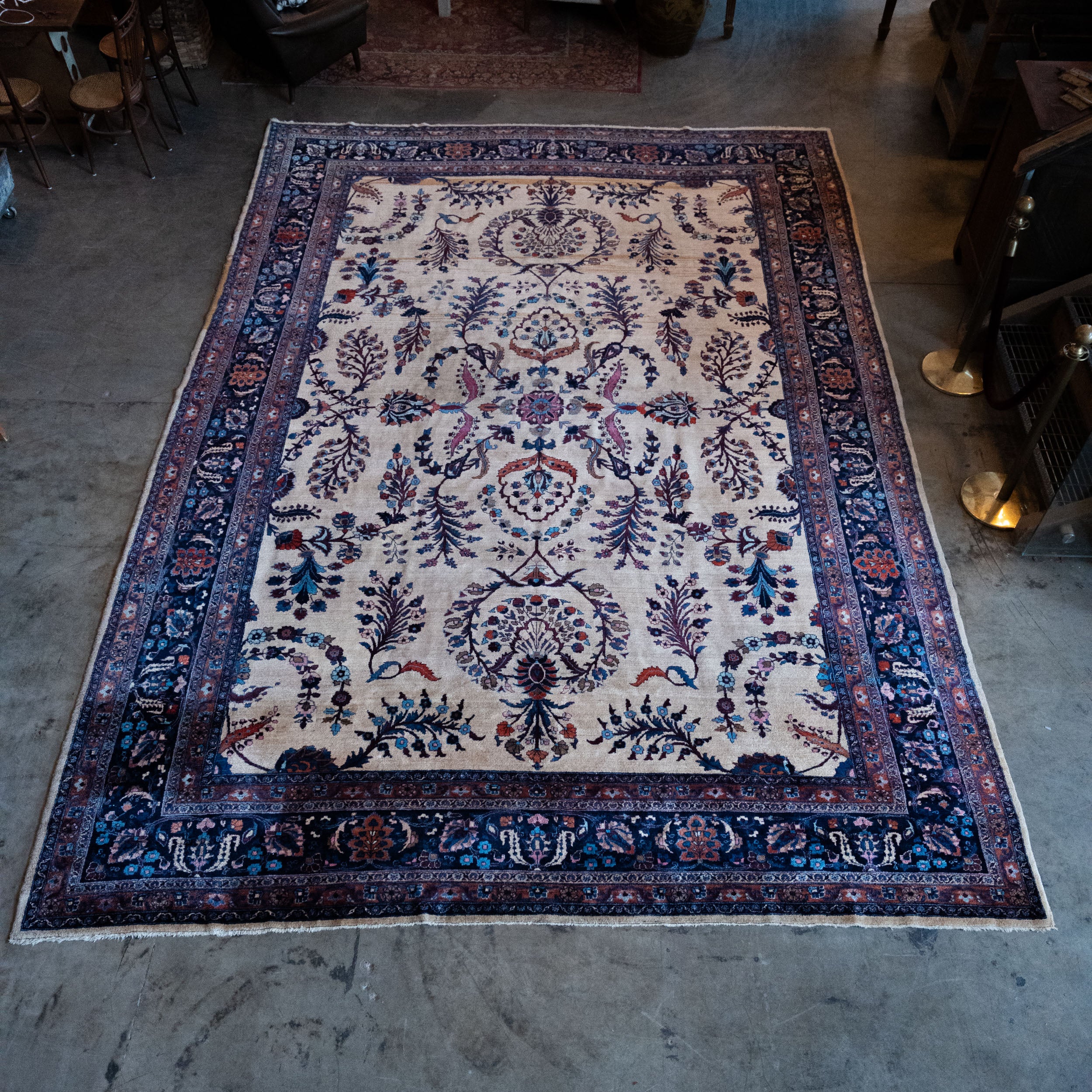 Antique Persian Hamadan hand-knotted wool carpet with navy field and rust floral borders, 11 x 16 feet