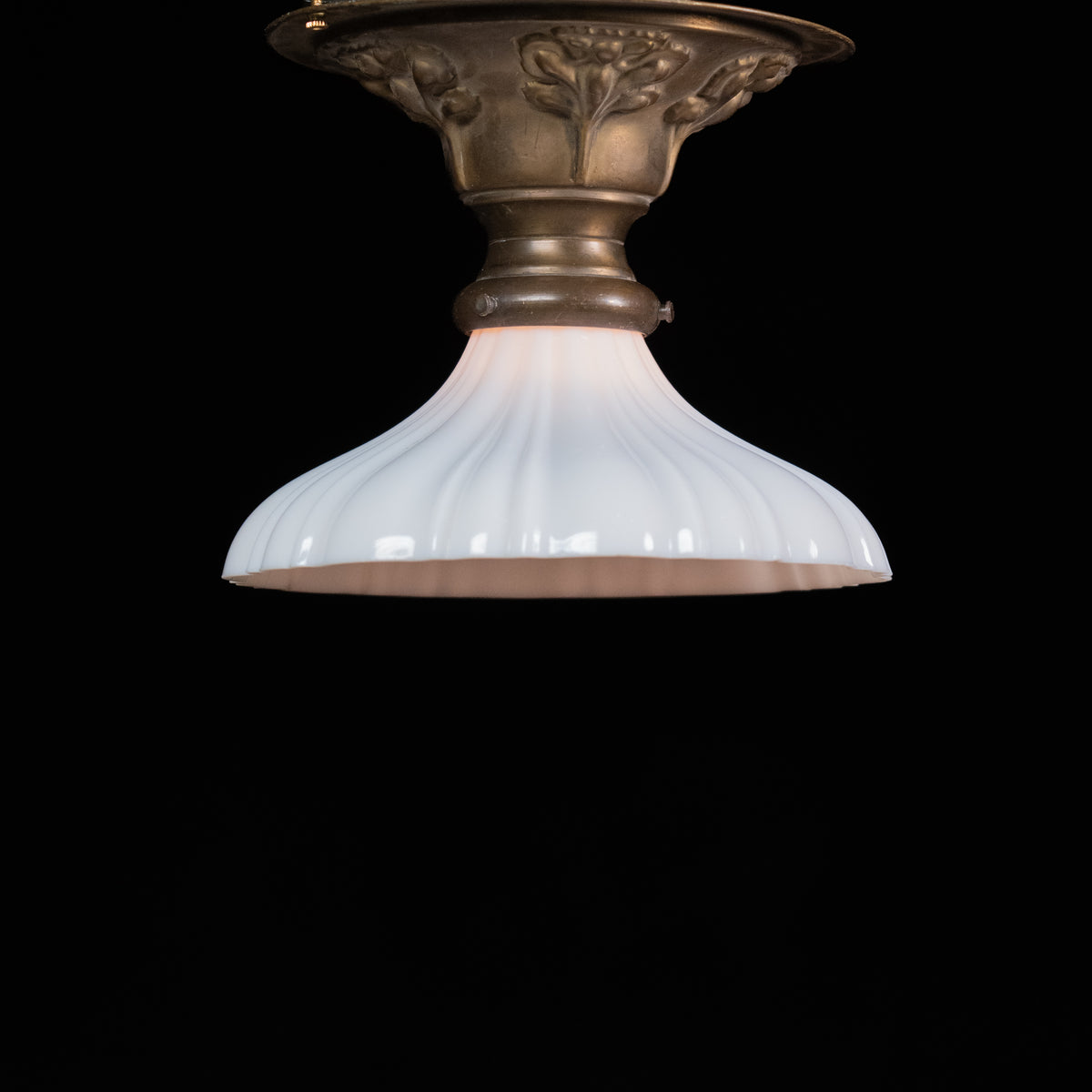     Antique brass flush mount ceiling light with flared ribbed milk glass shade, sourced in Chicago, circa 192 | Scott Landon Antiques and Interiors.