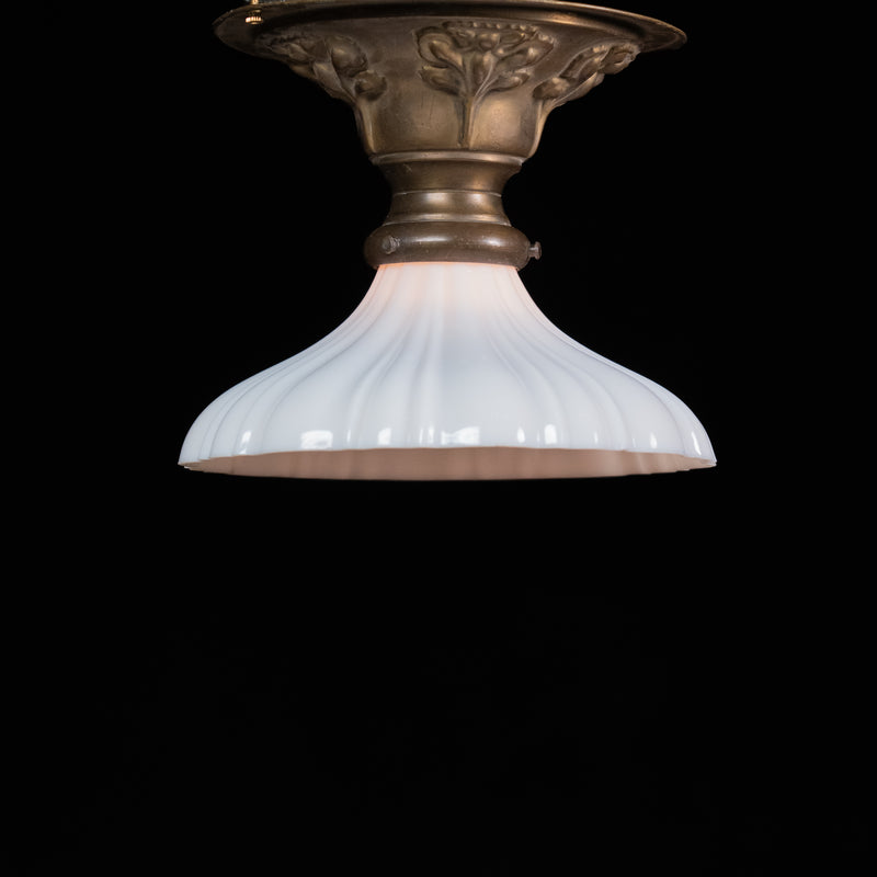     Antique brass flush mount ceiling light with flared ribbed milk glass shade, sourced in Chicago, circa 192 | Scott Landon Antiques and Interiors.