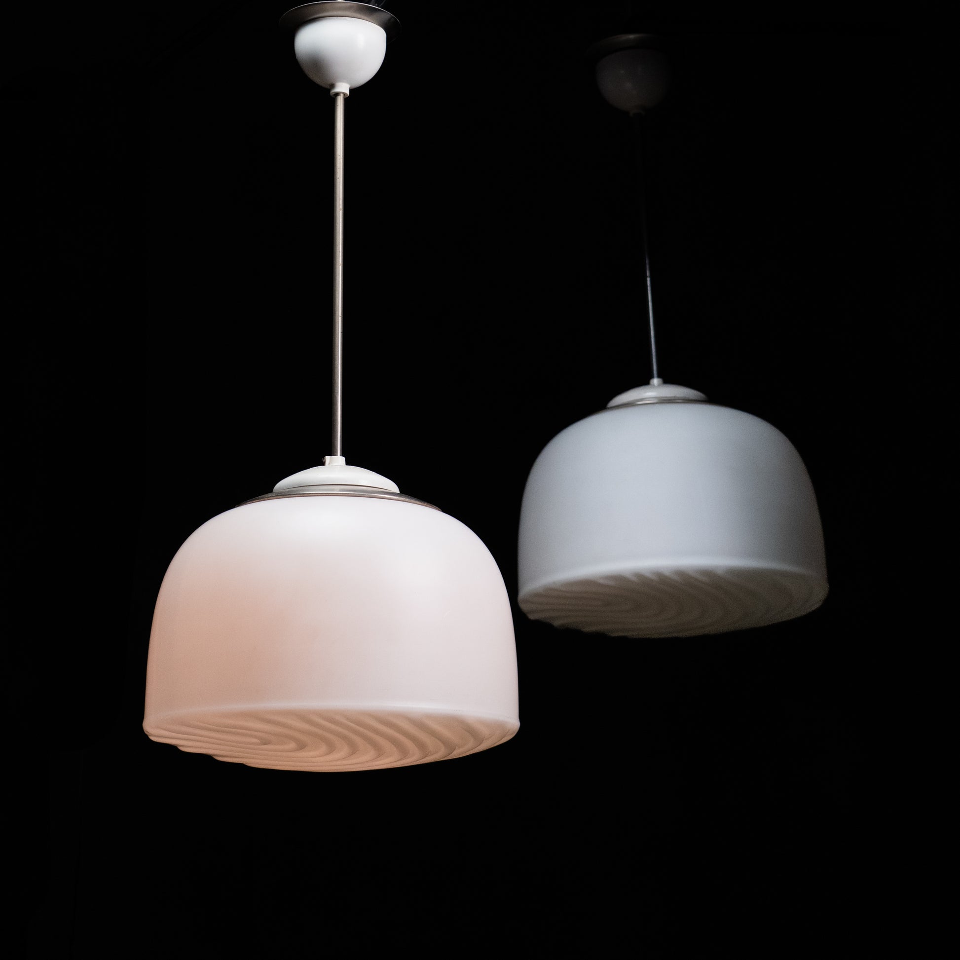 Antique white opaline glass pendant light with sculpted swirl pattern underside and original metal fittings, circa 1930s.