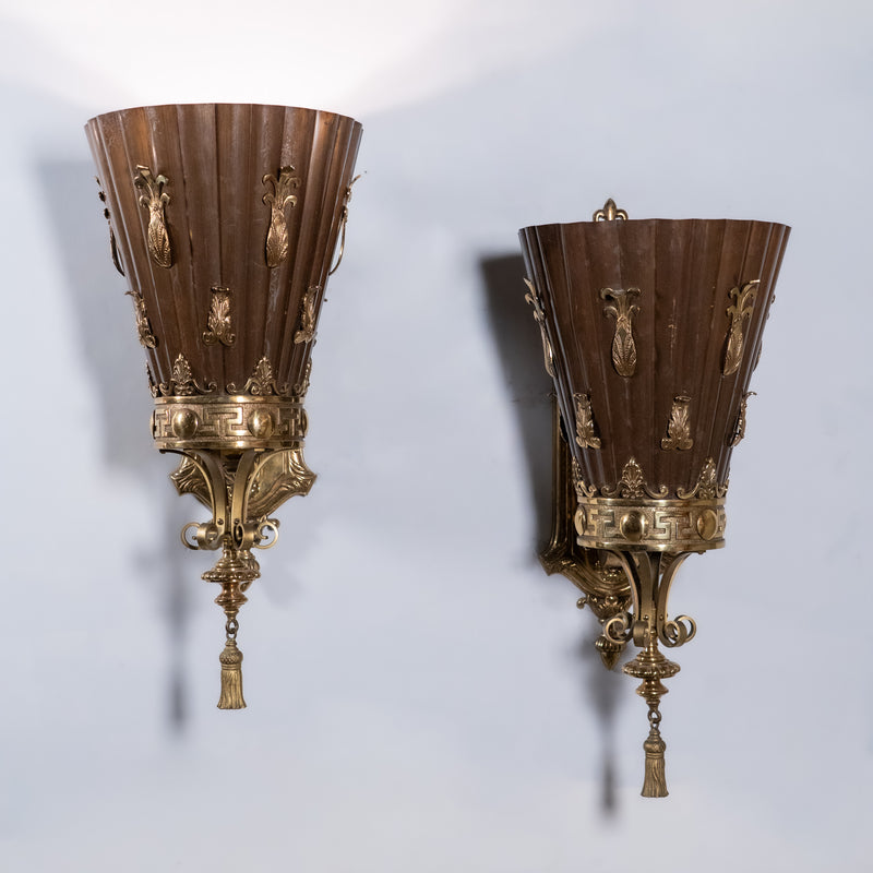 Set of four monumental Beaux-Arts bronze and copper wall sconces from a historic Montreal banking hall with torch-form shades and classical detailing