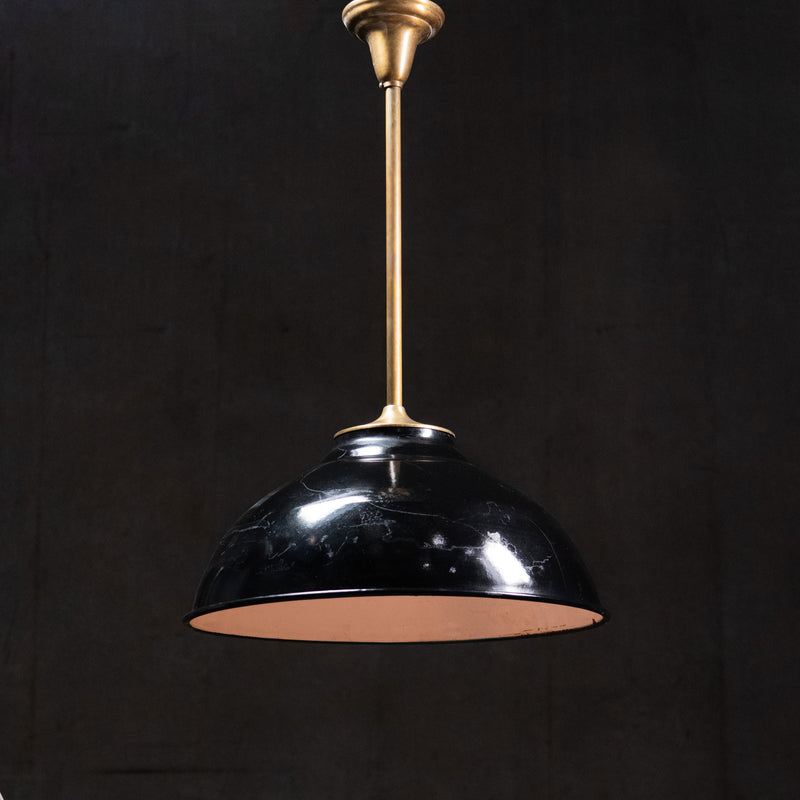 Scandinavian Modern black enamel pendant light with brass stem and white enamel interior, circa 1950