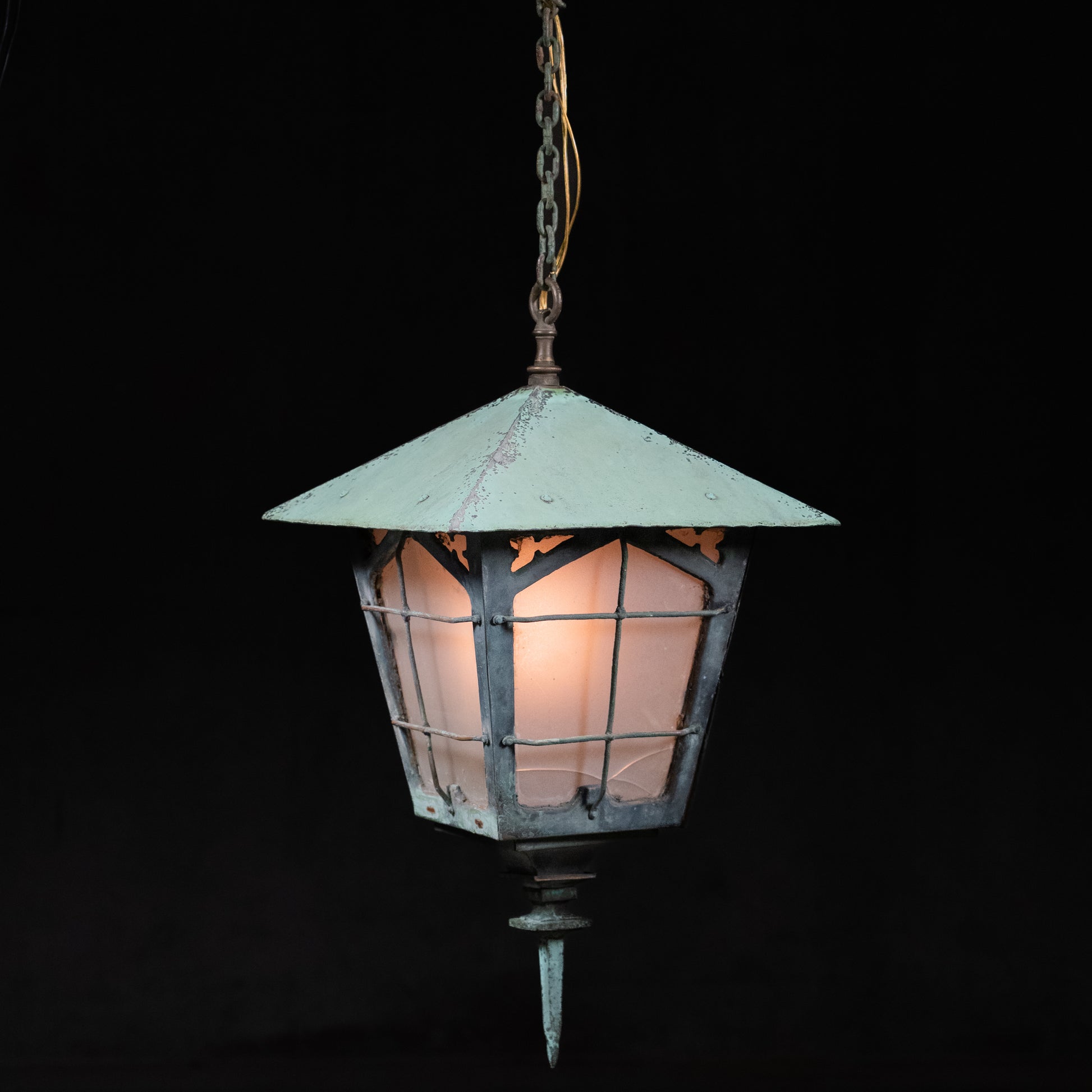  Antique copper lantern with hand-forged iron grille work, frosted glass panels, and verdigris patina, circa 1900 | Scott Landon Antiques and Interiors.
