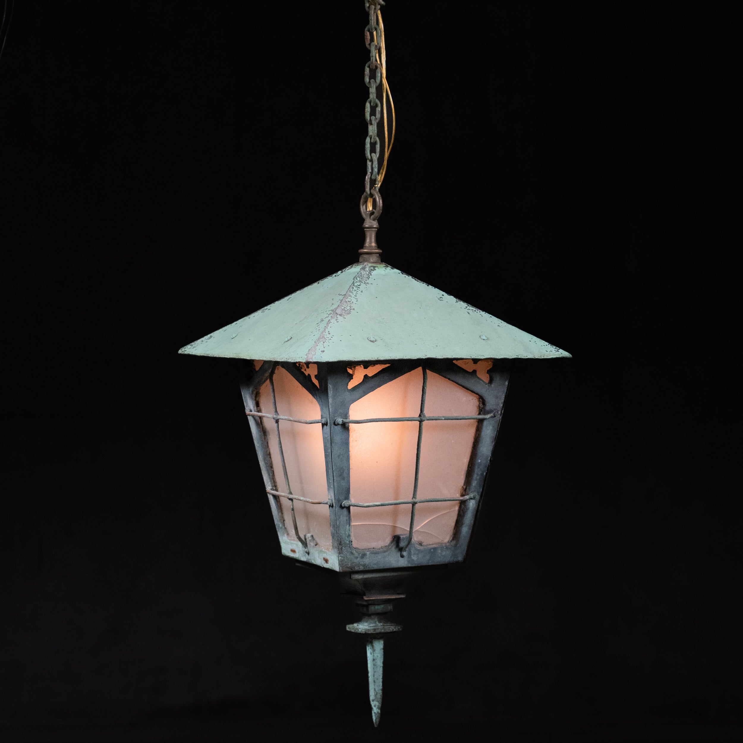  Antique copper lantern with hand-forged iron grille work, frosted glass panels, and verdigris patina, circa 1900 | Scott Landon Antiques and Interiors.