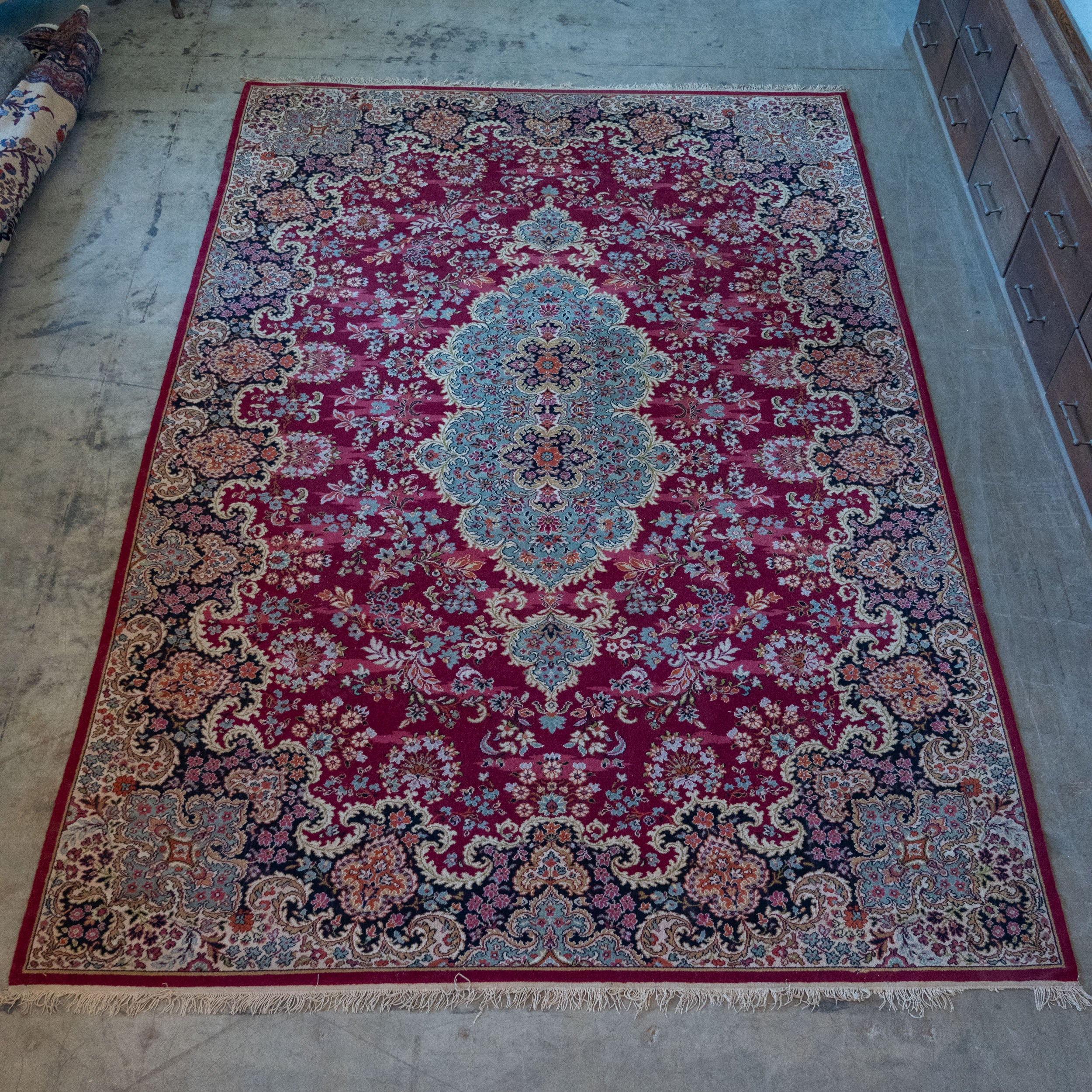 Hand-knotted vintage Persian rug featuring intricate floral motifs |Scott Landon Antiques and Interiors.