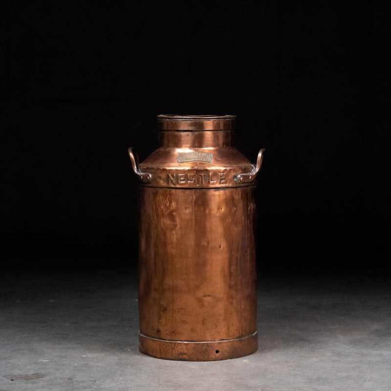 Antique Nestlé copper milk can with embossed lettering and original patina / Scott Landon Antiques and Interiors.