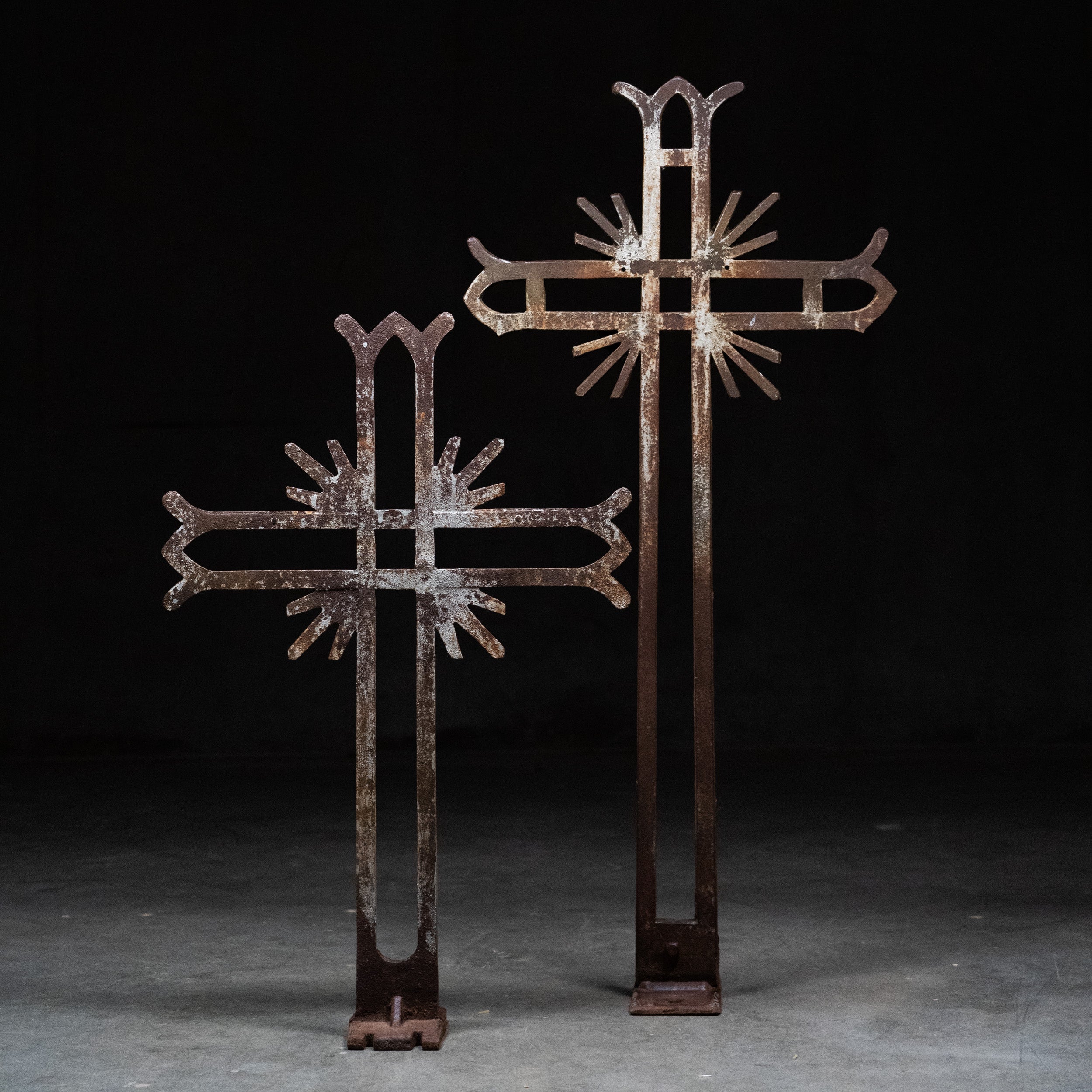 Pair of antique hand-forged wrought iron cemetery crosses with sunburst motifs and original weathered patina, circa 1880–1920 | Scott Landon Antiques and Interiors.