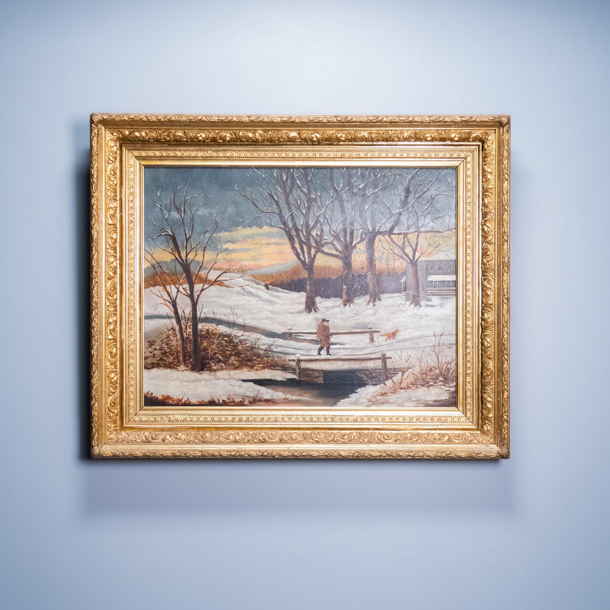American winter landscape oil painting with figure carrying firewood through snow | Scott Landon Antiques and Interiors.