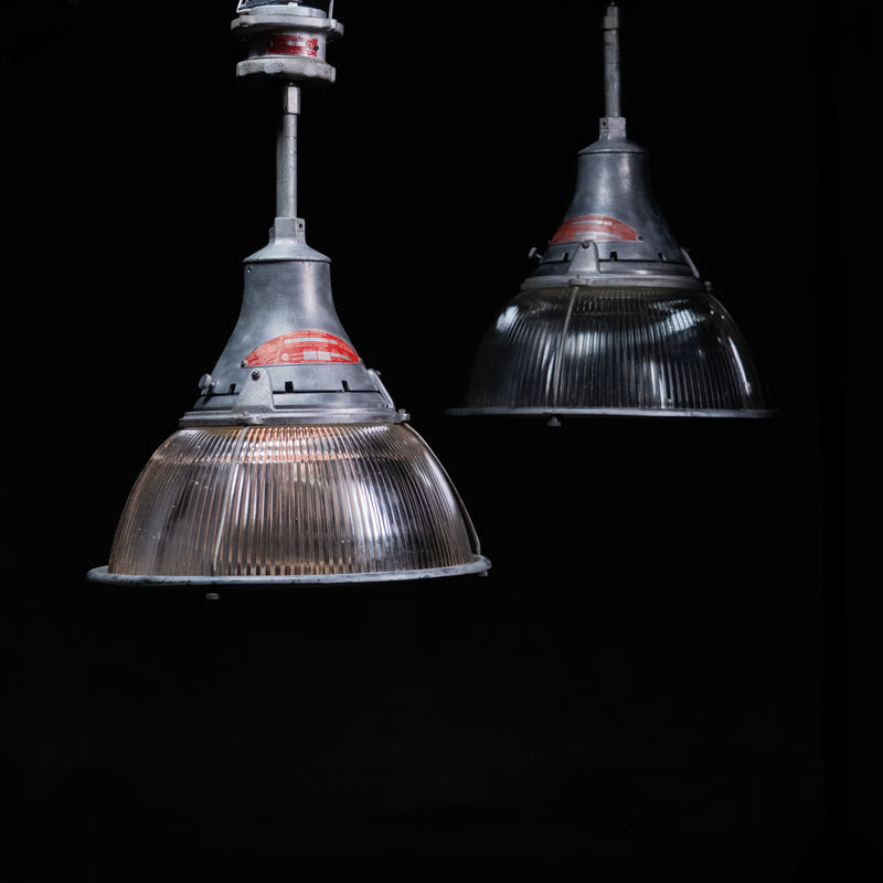    Set of four vintage Crouse-Hinds industrial pendant lights with prismatic Holophane-style glass | Scott Landon Antiques and Interiors.