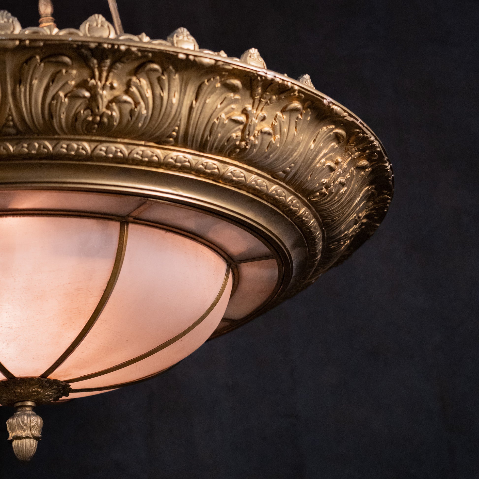 Close-up of ornate acanthus gilt casting on monumental Beaux Arts architectural chandelier | Scott Landon Antiques and Interiors.
