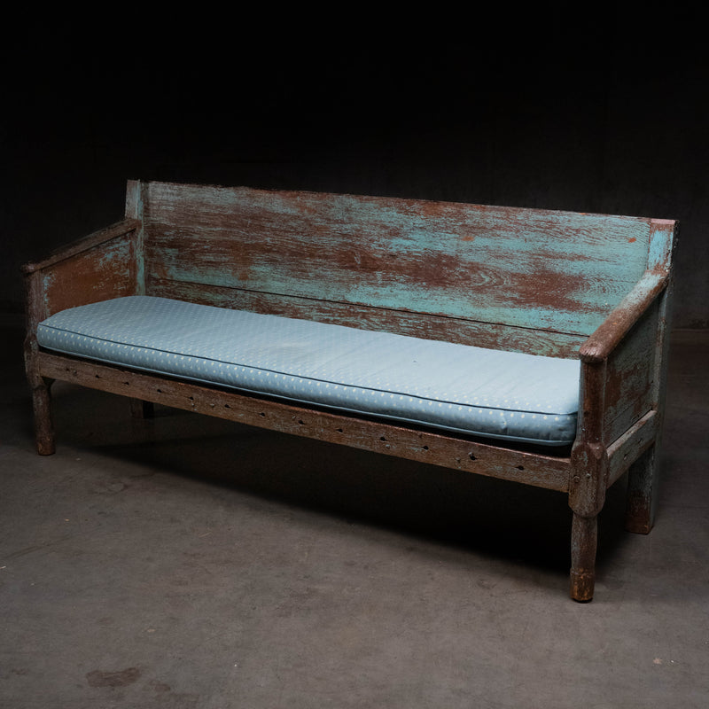 19th century Canadian East Coast primitive pine bench with original blue painted surface and custom cushion.