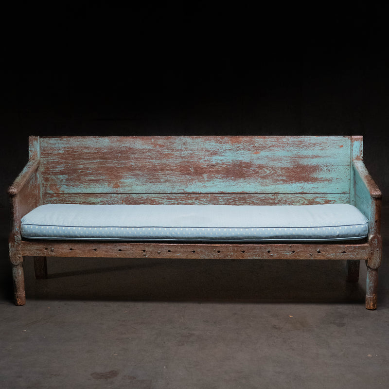 19th century Canadian East Coast primitive pine bench with original blue painted surface and custom cushion.