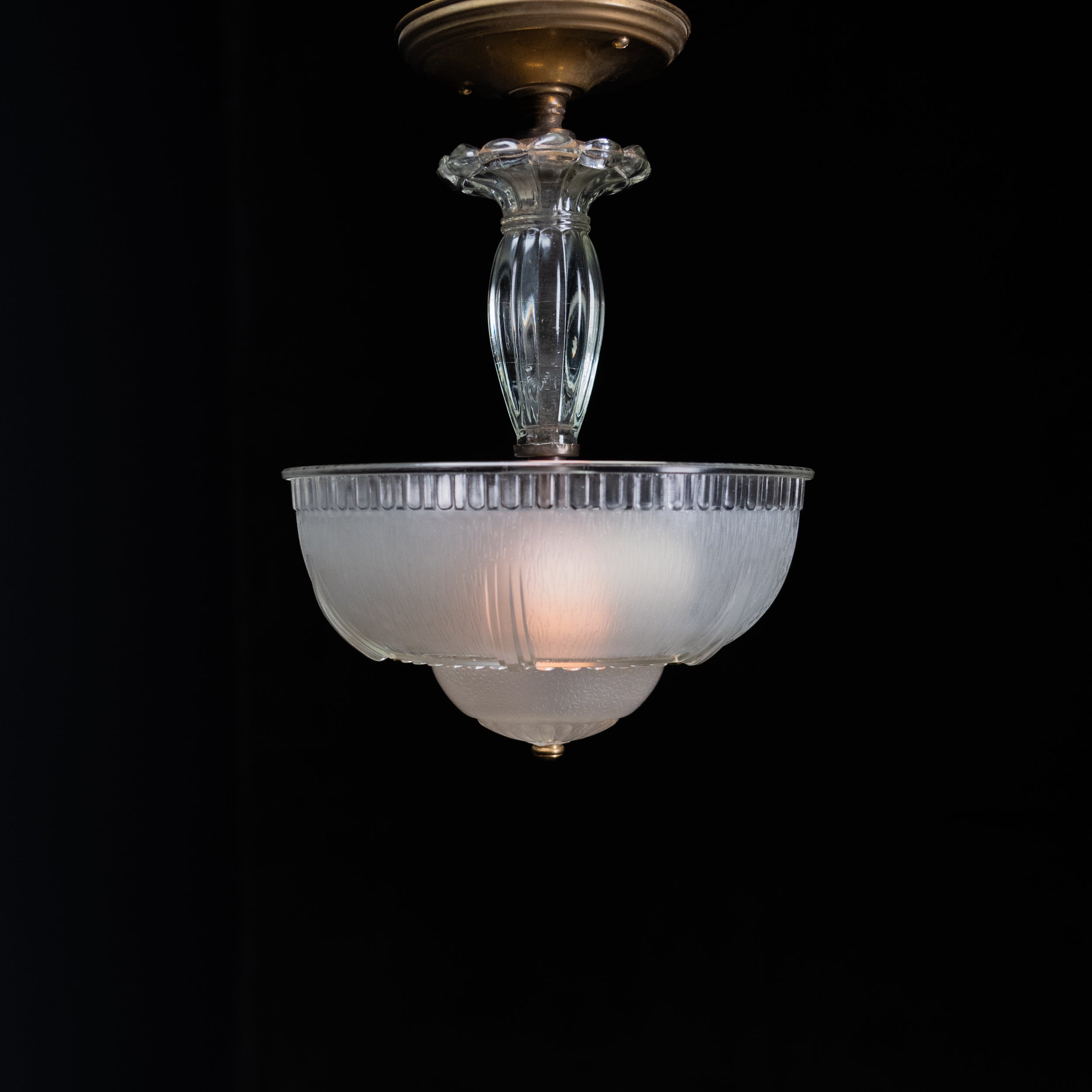 Original 1930s Art Deco semi flush ceiling light with 11-inch frosted glass shade, clear pressed-glass stem, and antique brass canop