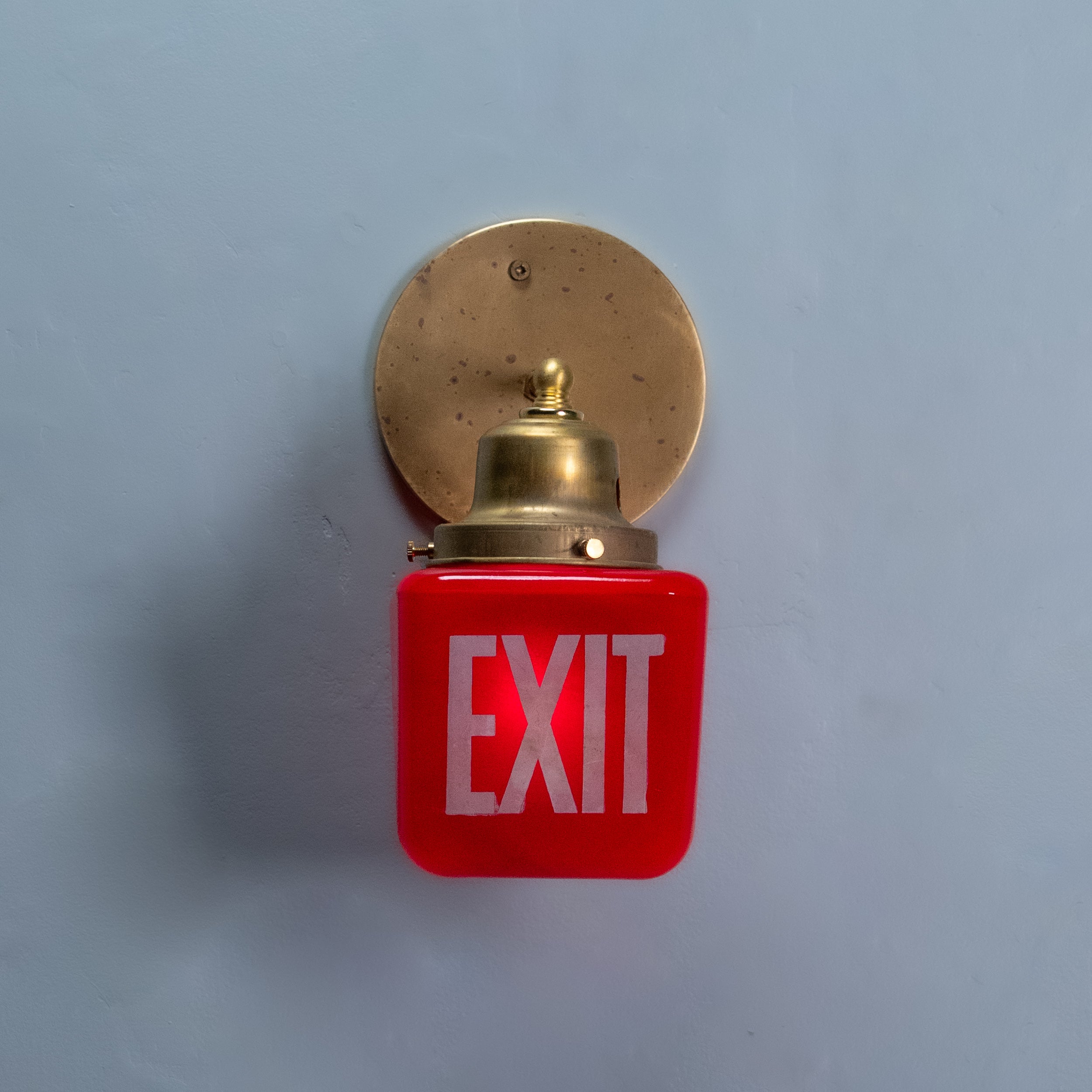 exit  red light sconce | Scott Landon Antiques and Interiors.
