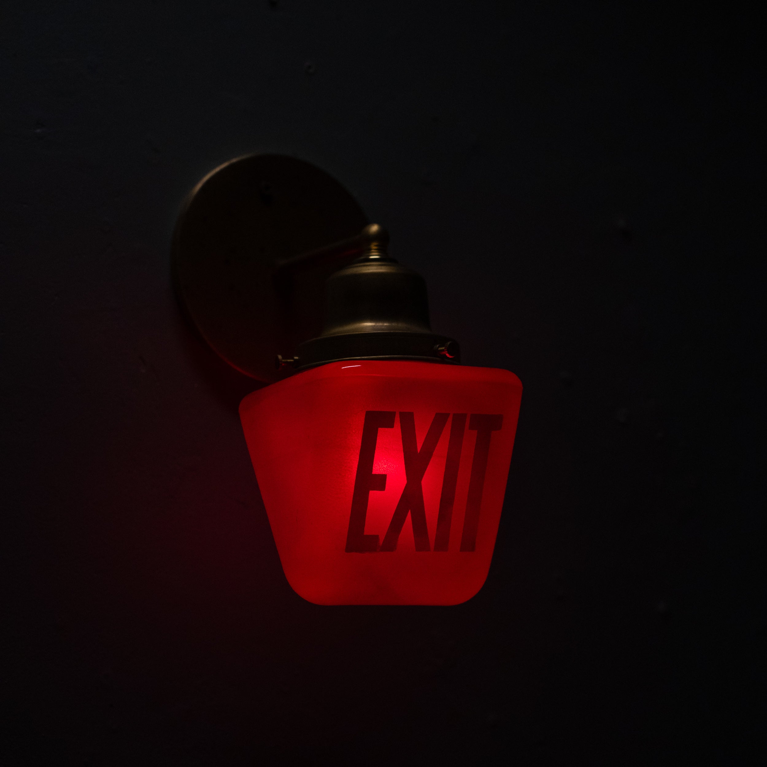 exit light sconce | Scott Landon Antiques and Interiors.