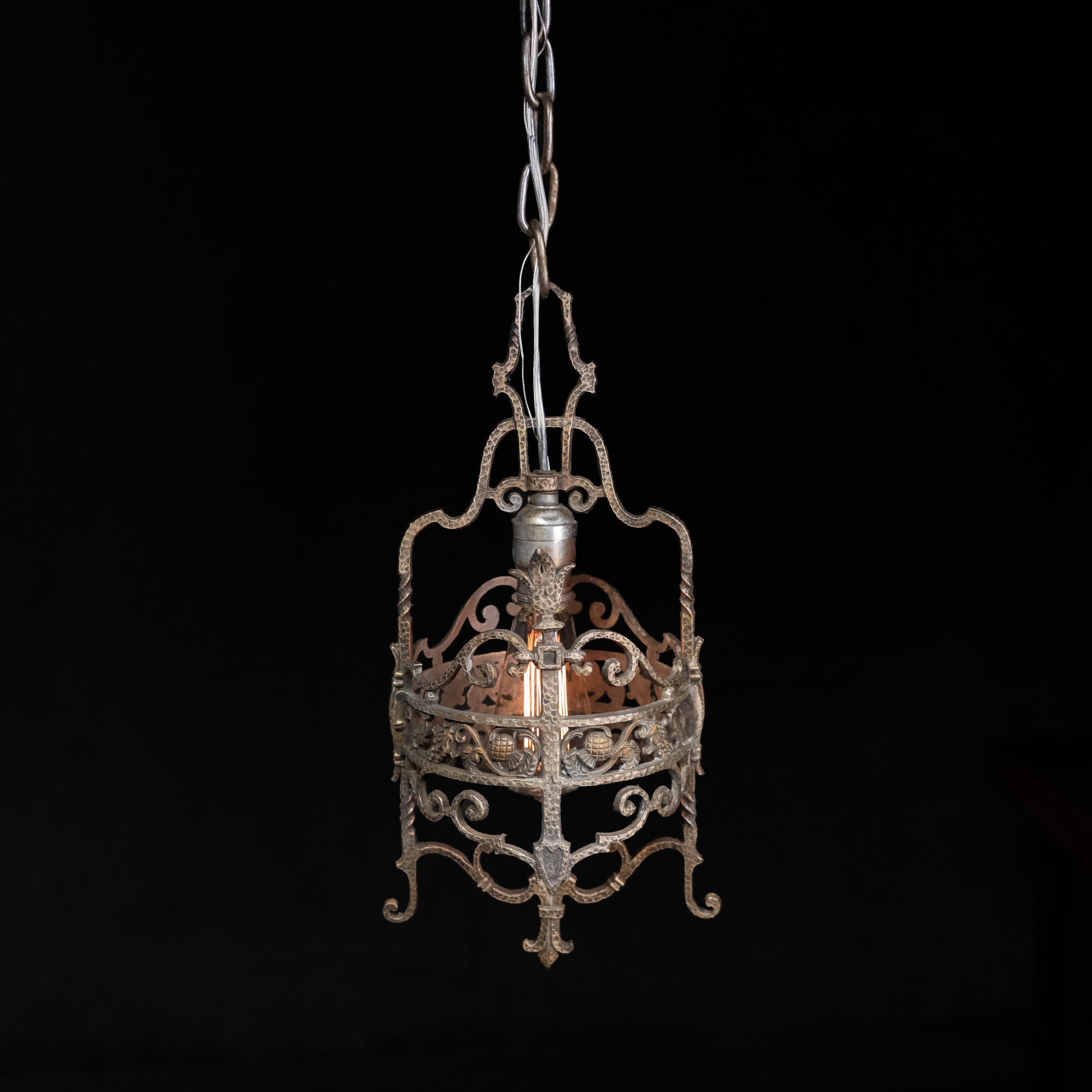 1920s hand-forged Spanish Revival wrought iron pendant lantern with Gothic scrollwork and original aged patina. | Scott Landon Antiques and Interiors.