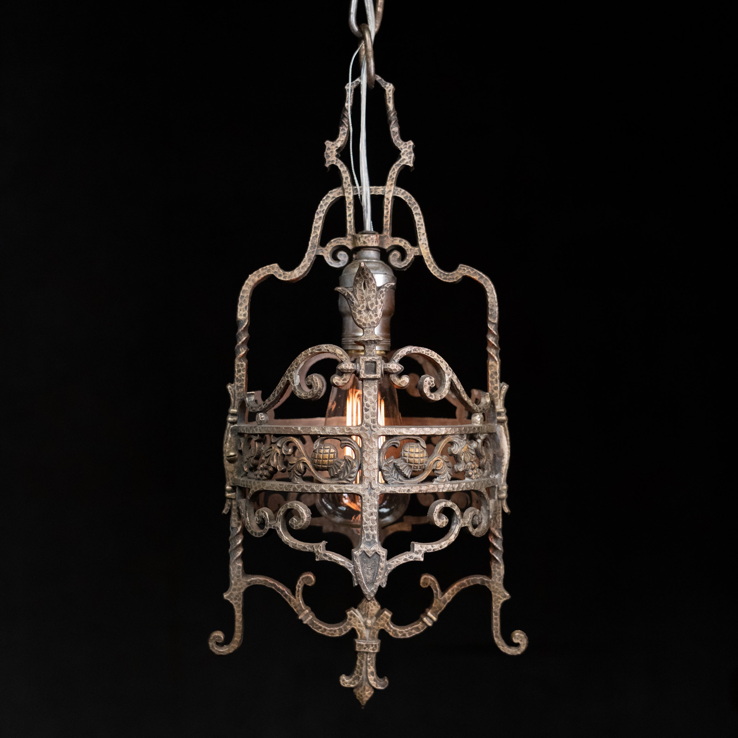 1920s hand-forged Spanish Revival wrought iron pendant lantern with Gothic scrollwork and original aged patina. | Scott Landon Antiques and Interiors.