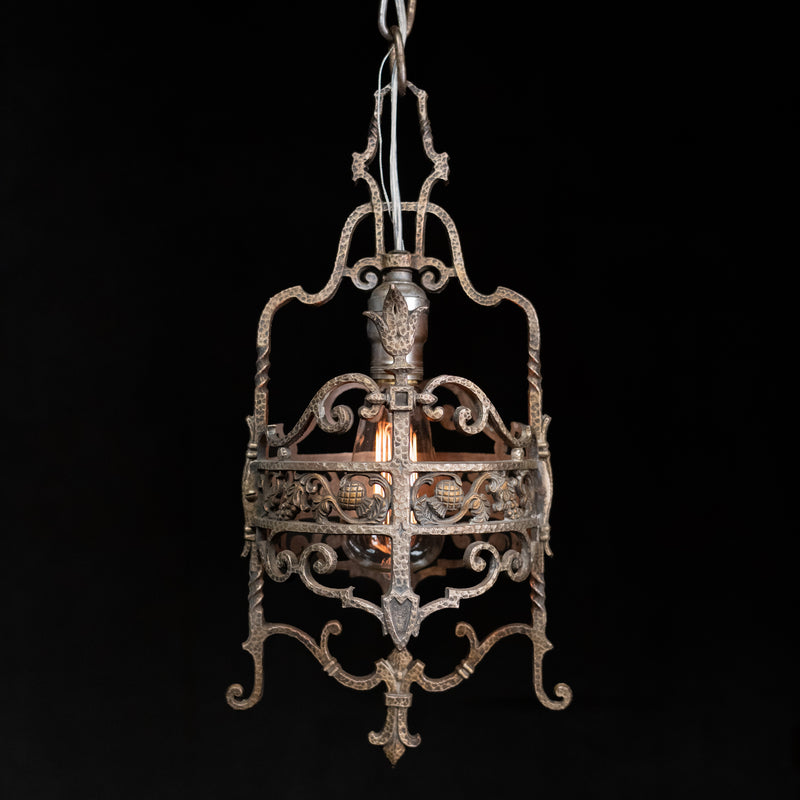 1920s hand-forged Spanish Revival wrought iron pendant lantern with Gothic scrollwork and original aged patina. | Scott Landon Antiques and Interiors.