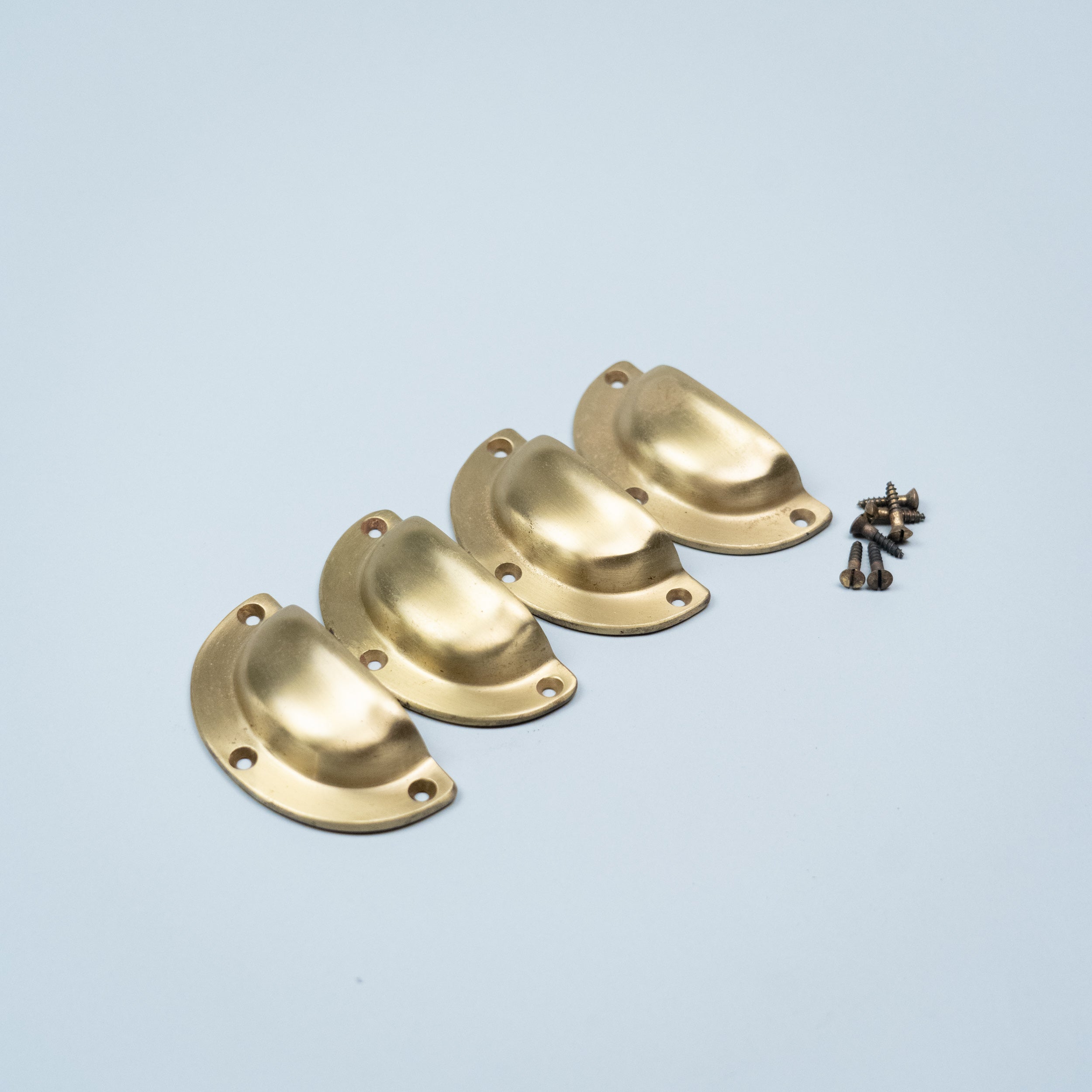New Old Stock Corbin solid brass cup drawer pull with original mounting screws, vintage cabinet and furniture hardware.