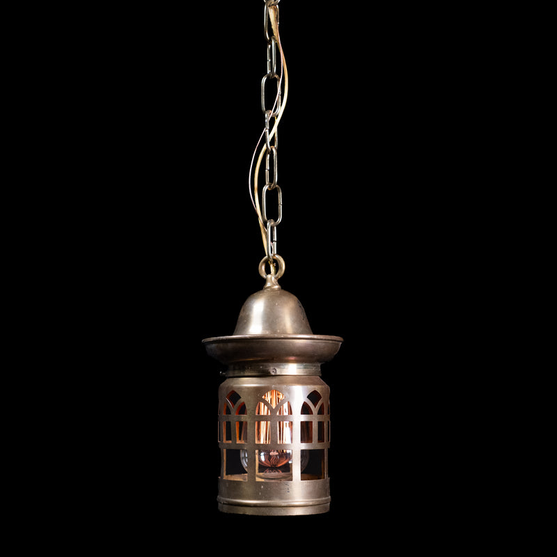Early 20th-century antique brass lantern pendant with pierced Gothic-style window detailing.