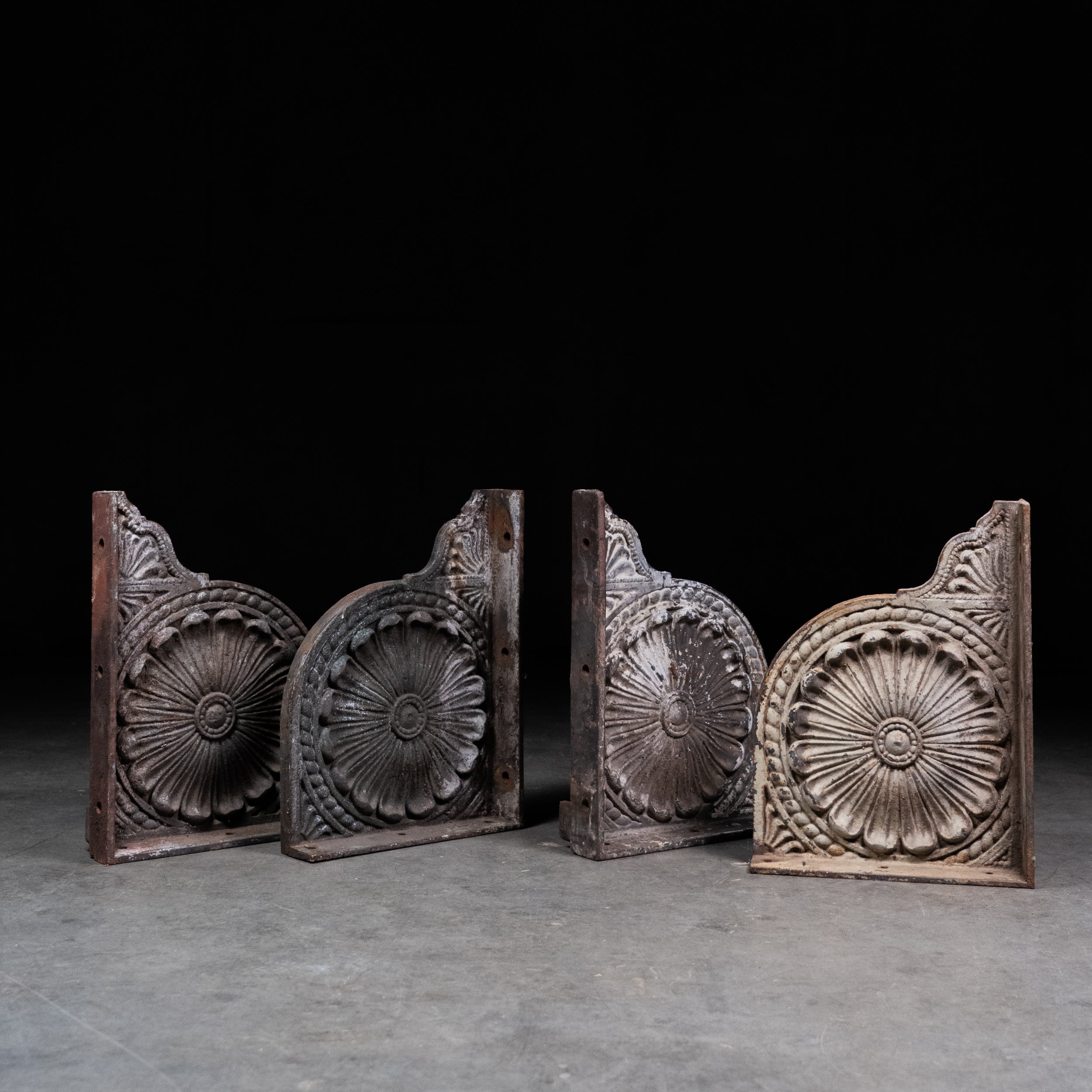 Pair of antique Victorian cast iron architectural brackets with raised rosette decoration. | Scott Landon Antiques and Interiors.
