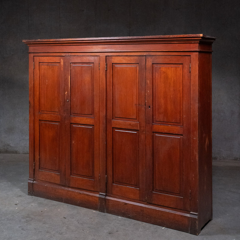 Antique four-door solid fir school cupboard from the Pacific Northwest with original stained finish dating to circa 1890–1905.