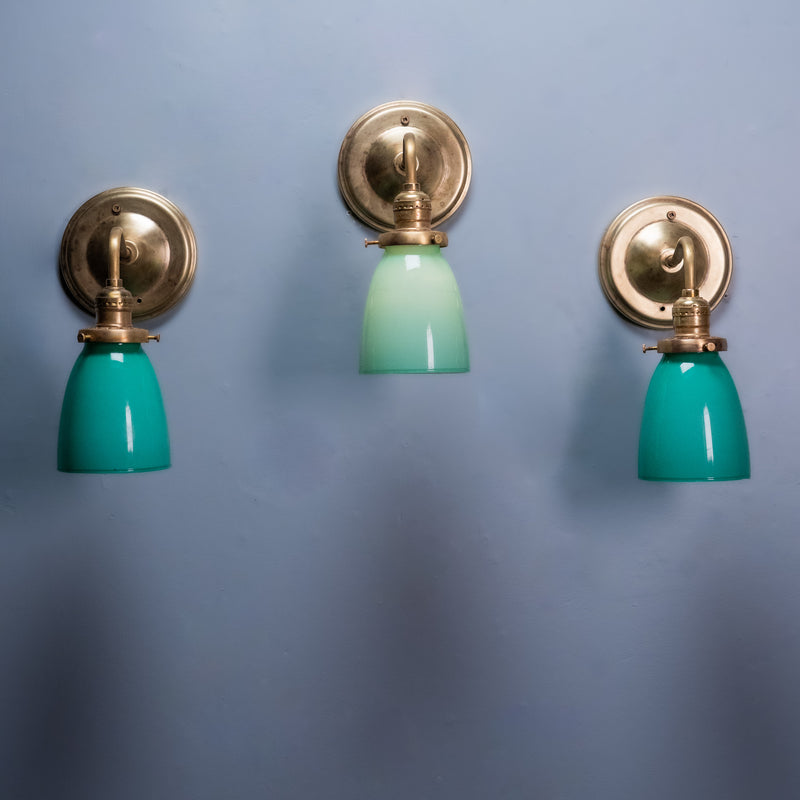 Antique brass wall sconce with green opaline glass shade, Art Deco vintage wall light.