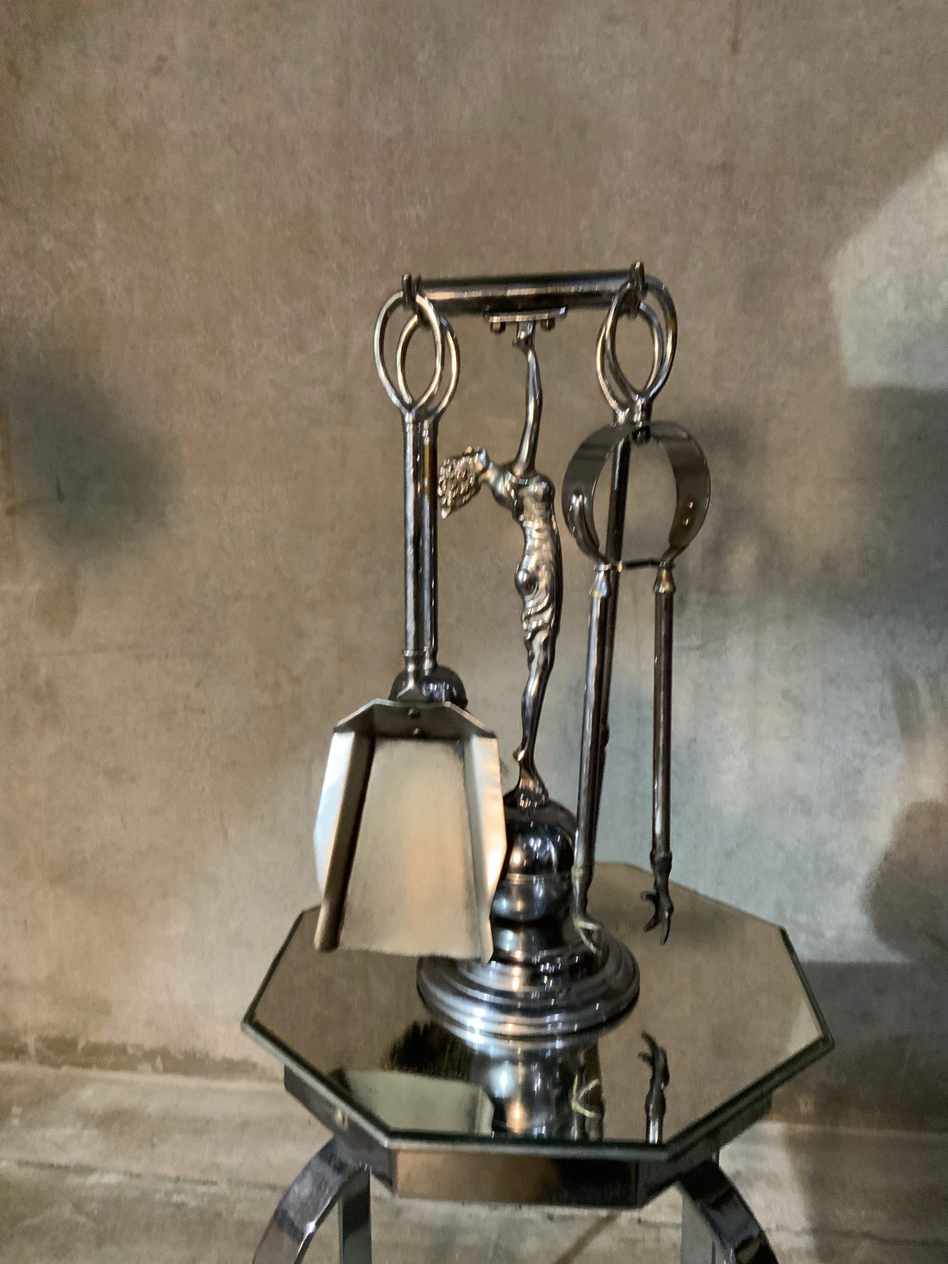 1930 set of figurative. Fireplace tools | Scott Landon Antiques and Interiors.