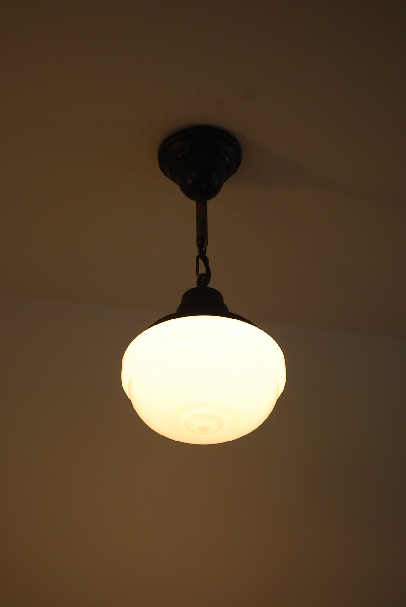 Set of 4 1920 Black over Brass Milk glass Pendant lights | Scott Landon Antiques and Interiors.