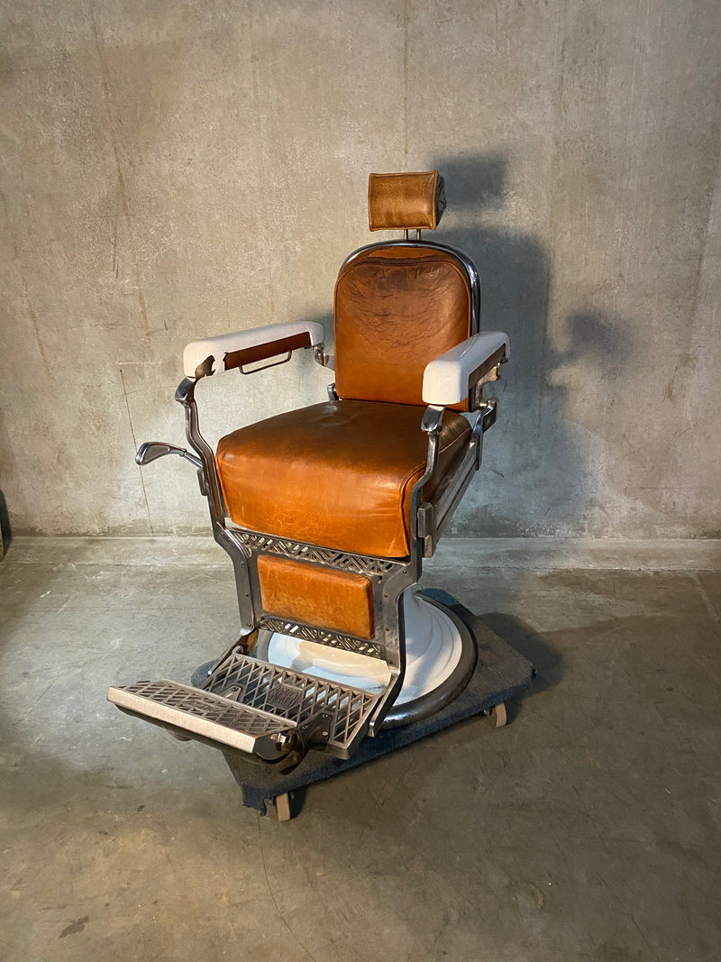 Koken first generation Porcelain barber chair  in old Leather | Scott Landon Antiques and Interiors.